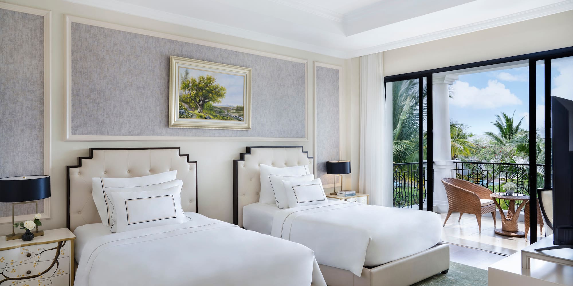 a room with two beds and a balcony