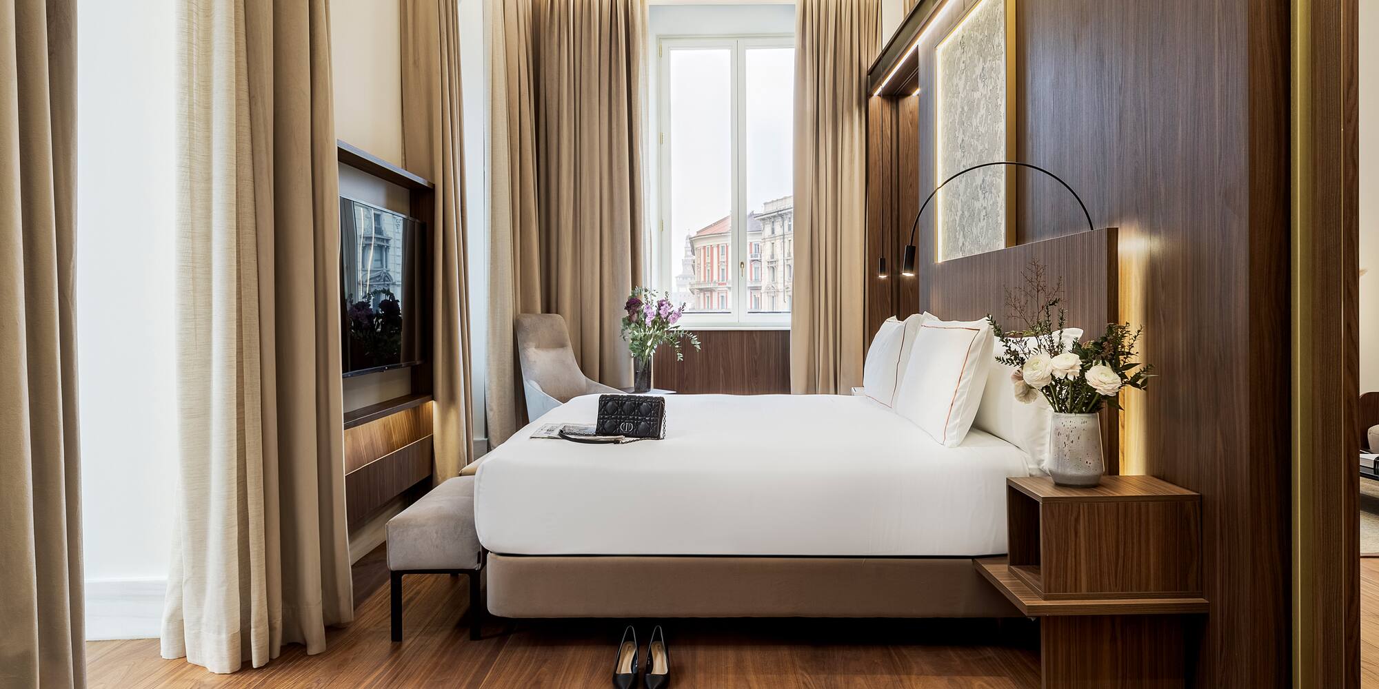 a bedroom with a bed and a tv