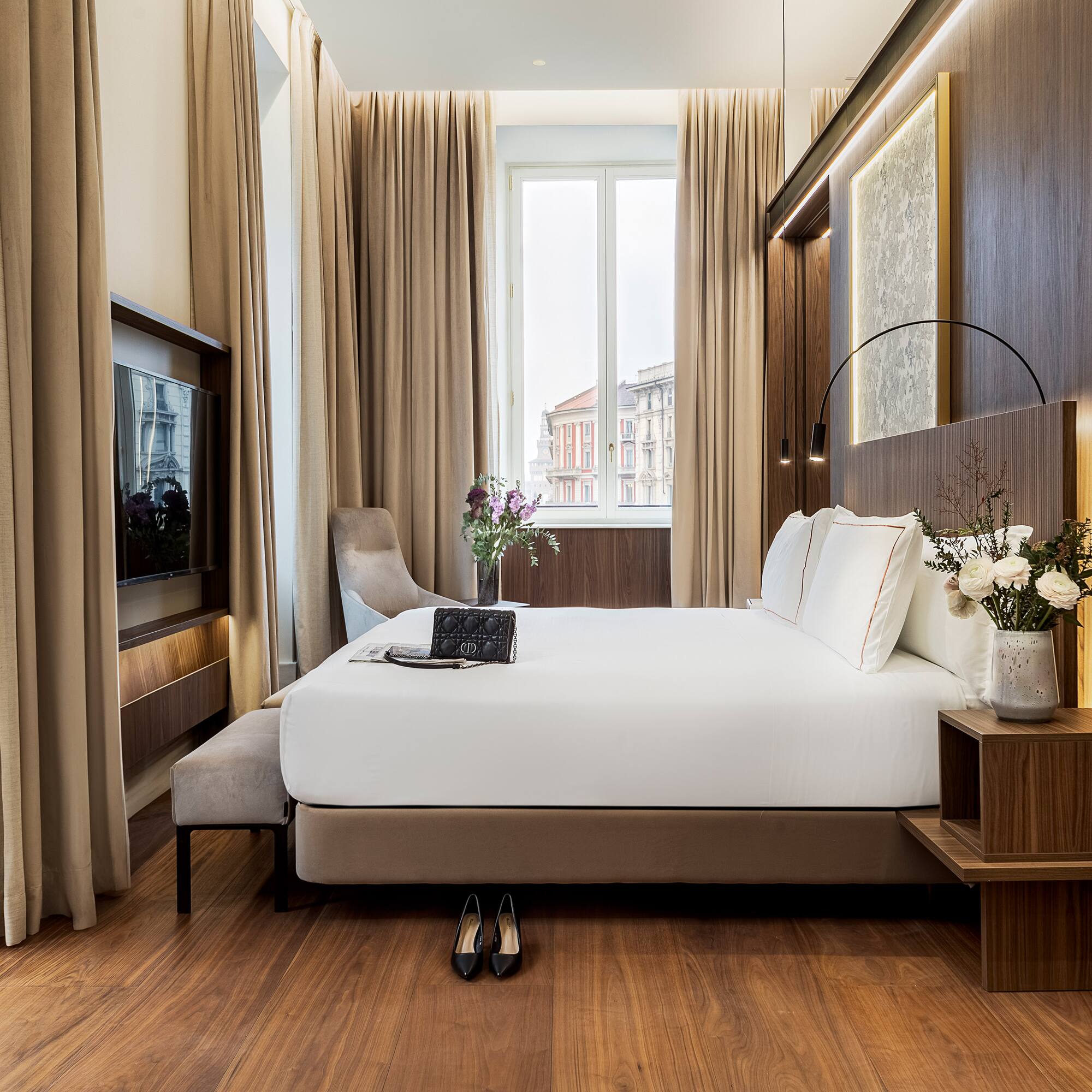 a bedroom with a bed and a tv