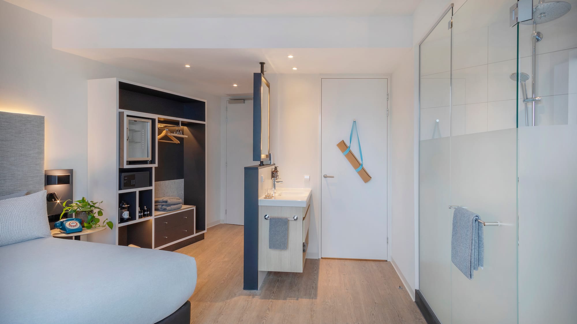 a room with a bed and sink