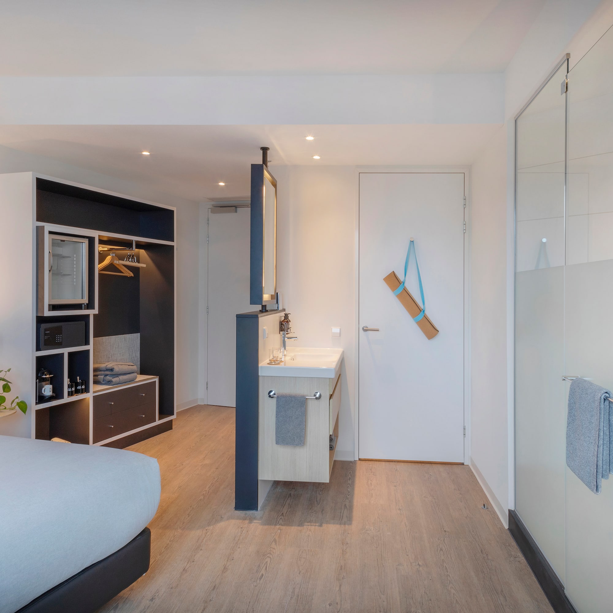 a room with a bed and sink