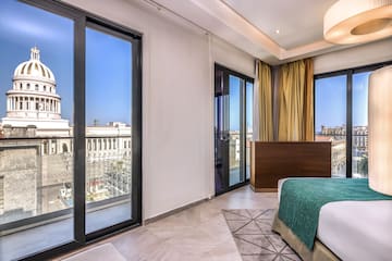 a bedroom with a bed and glass doors