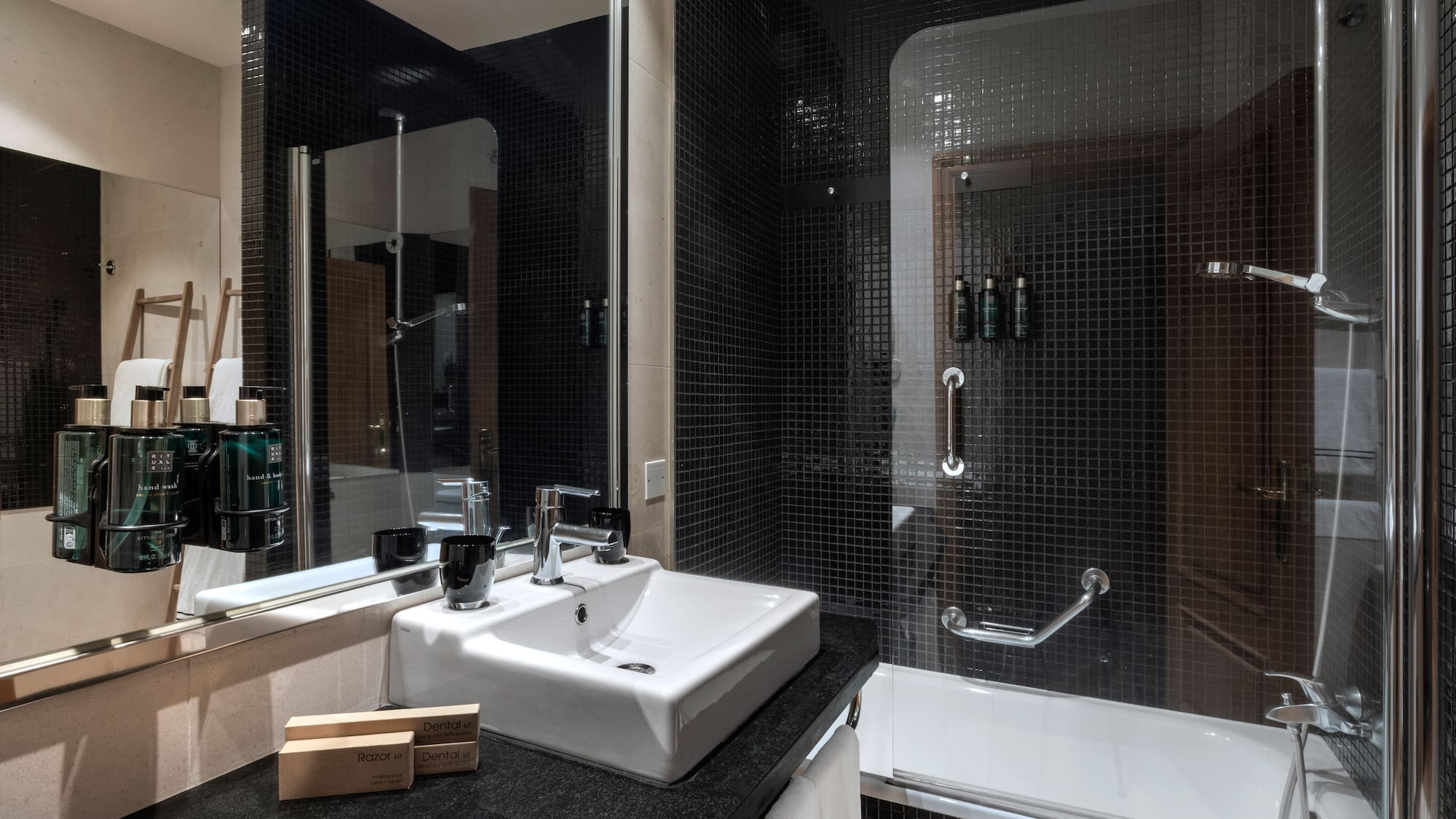 a bathroom with a sink and shower