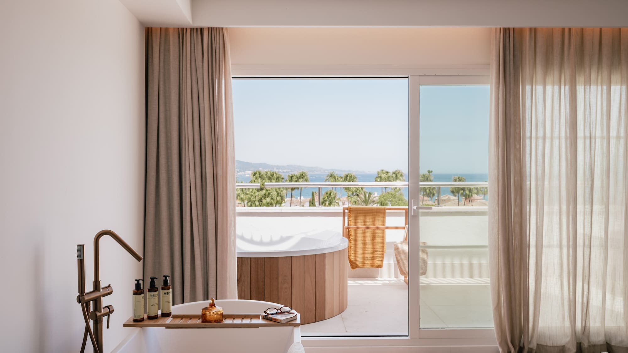 a bathroom with a tub and a jacuzzi