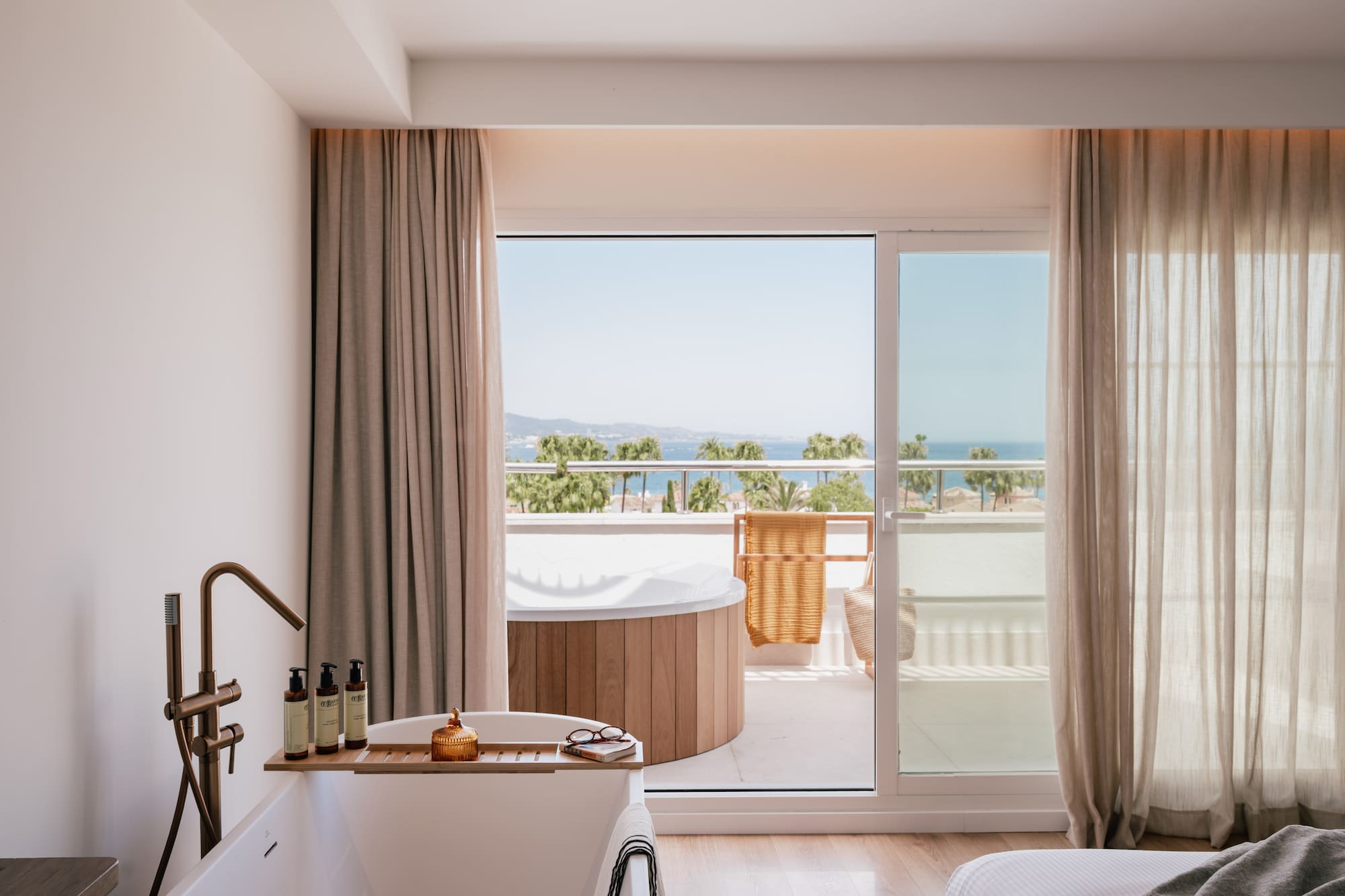 a bathroom with a tub and a jacuzzi
