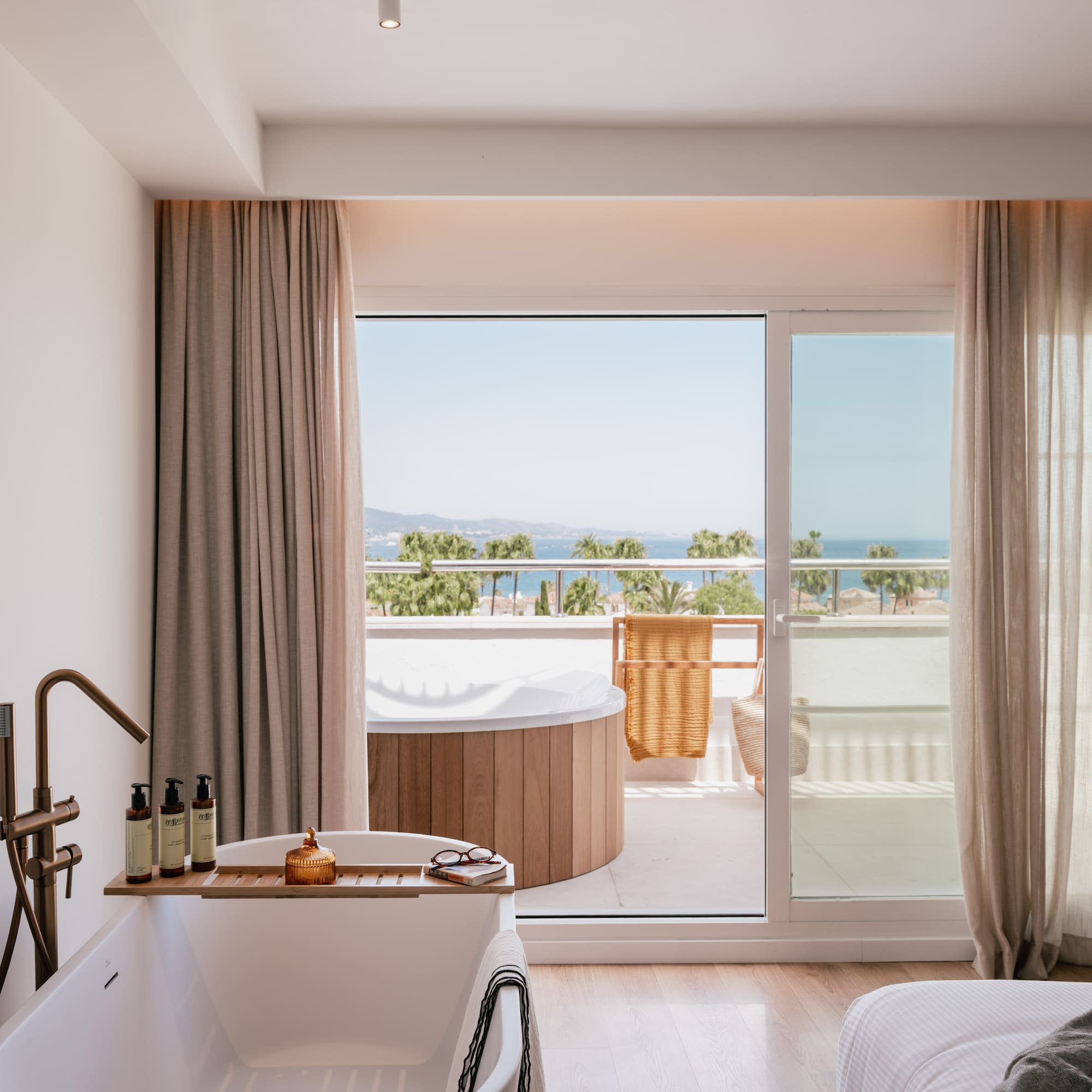 a bathroom with a tub and a jacuzzi