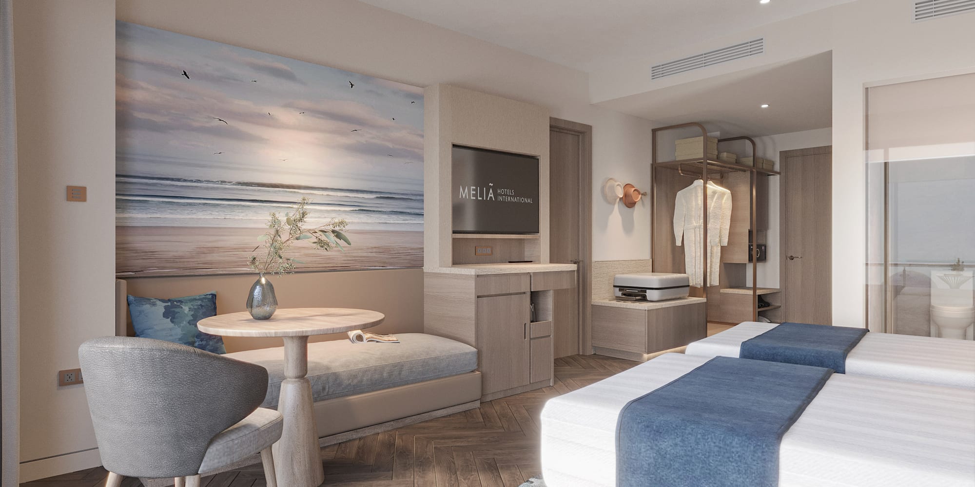 a room with two beds and a table