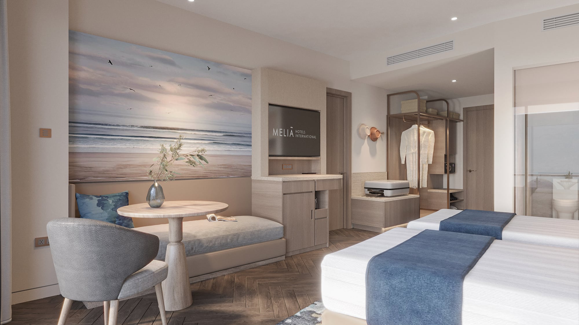 a room with two beds and a table