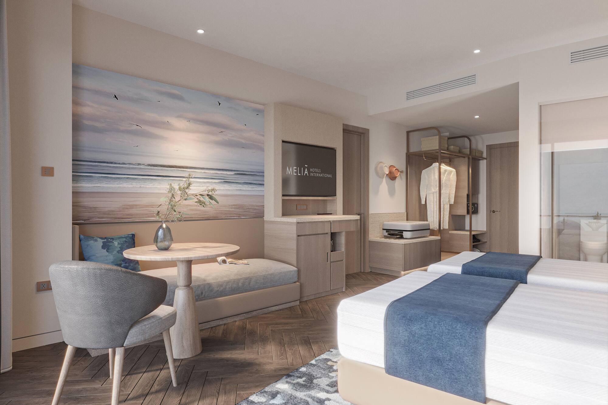 a room with two beds and a table