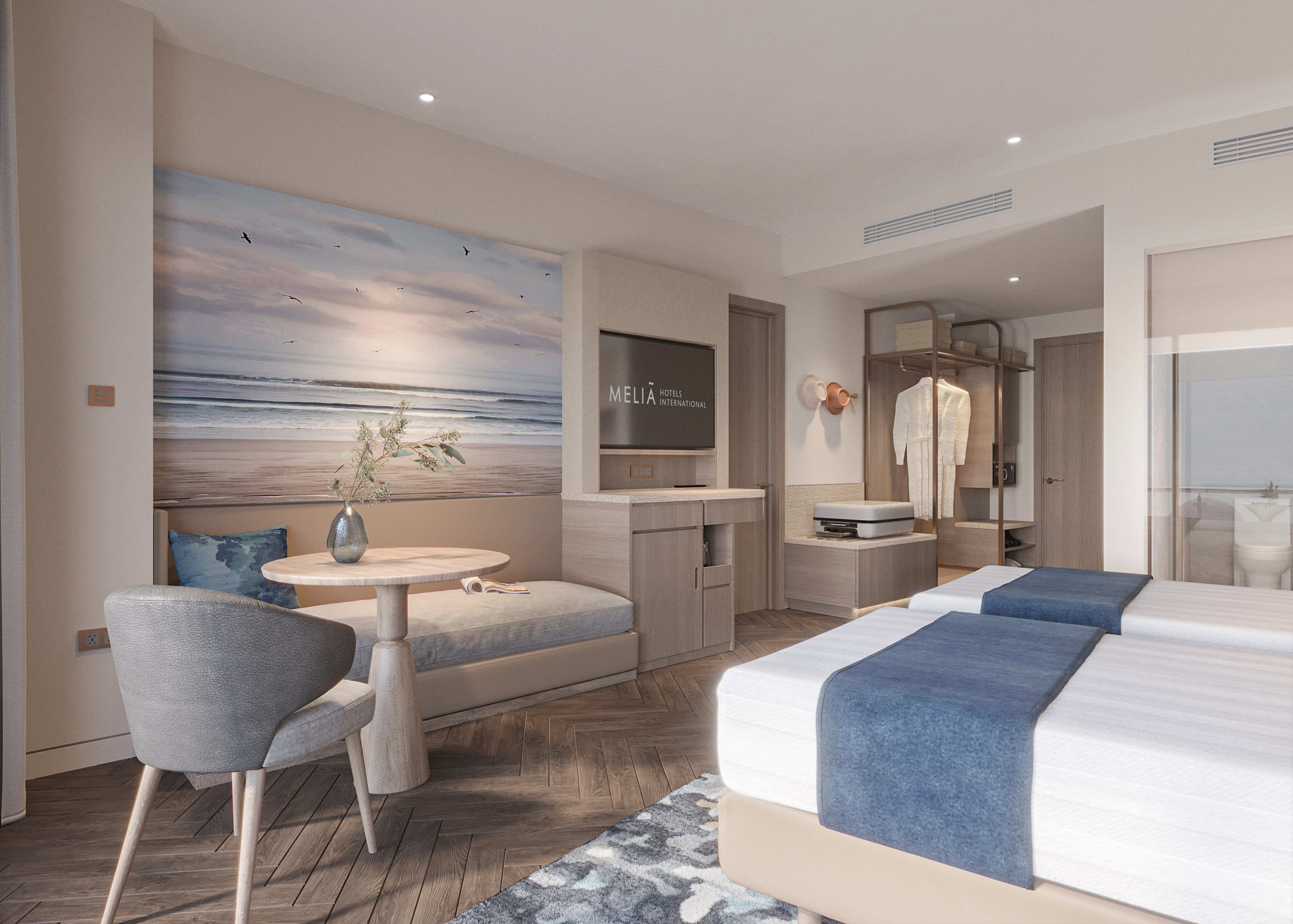 a room with two beds and a table