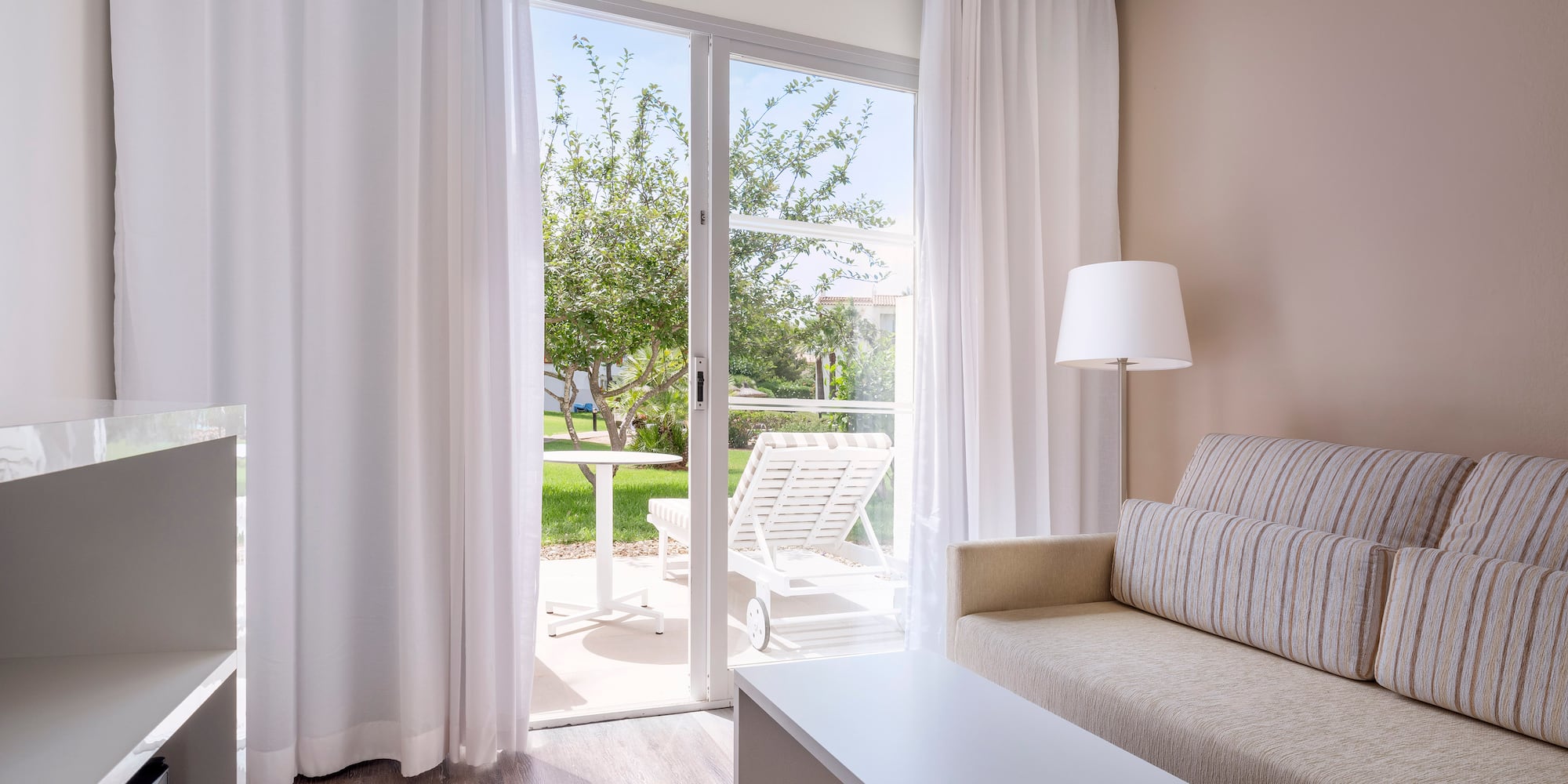 a living room with a couch and a table