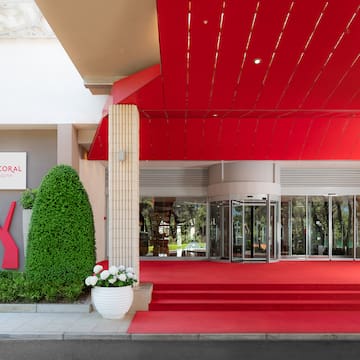a red carpeted entrance to a building