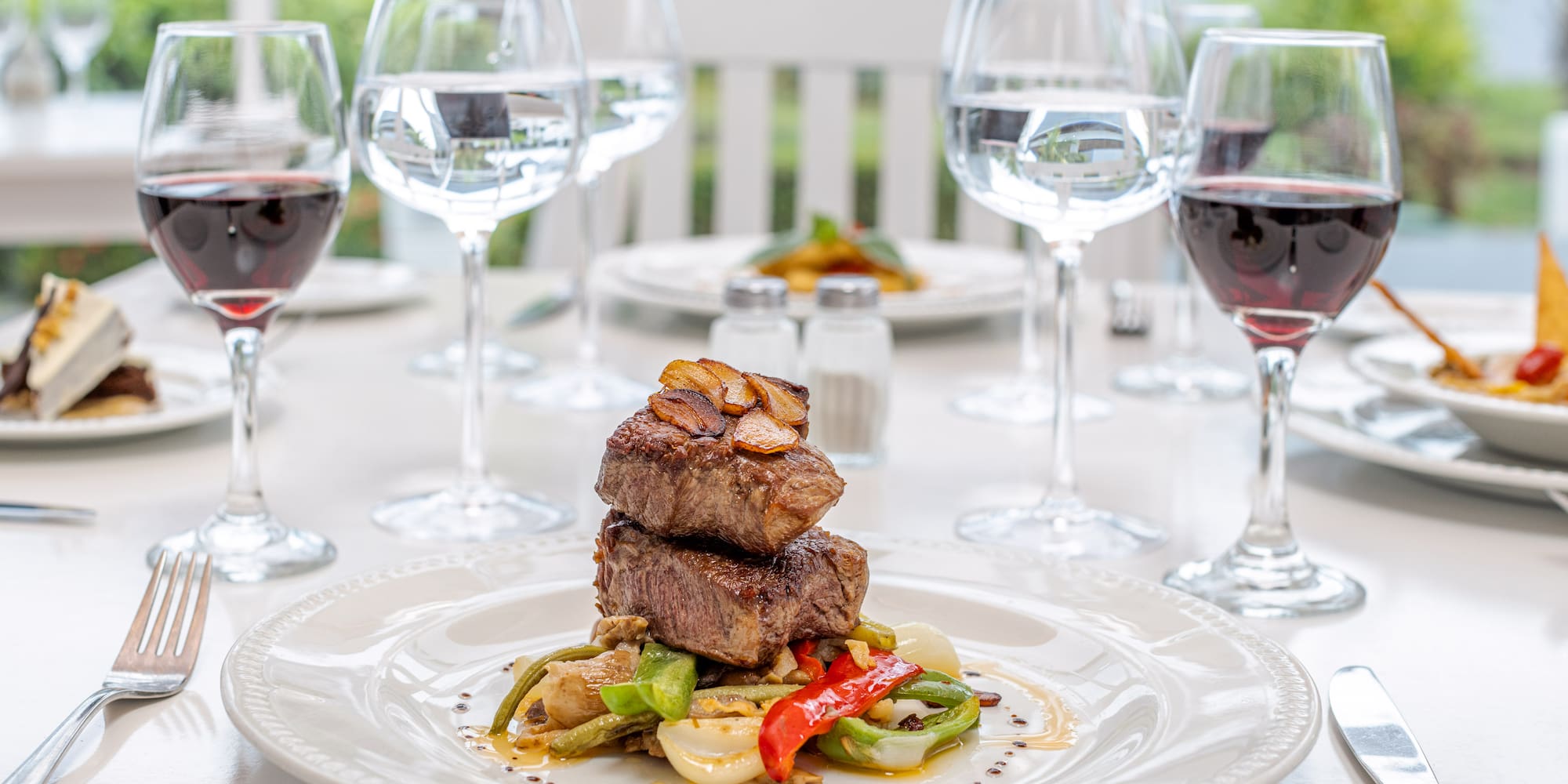 a plate of food and wine glasses