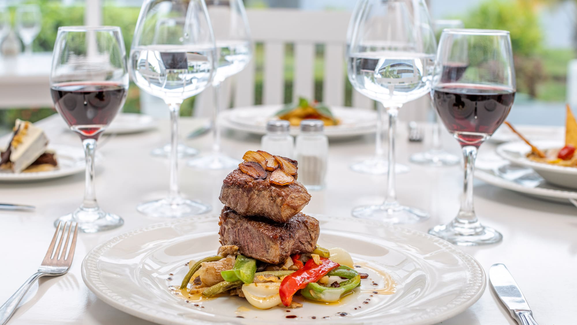 a plate of food and wine glasses