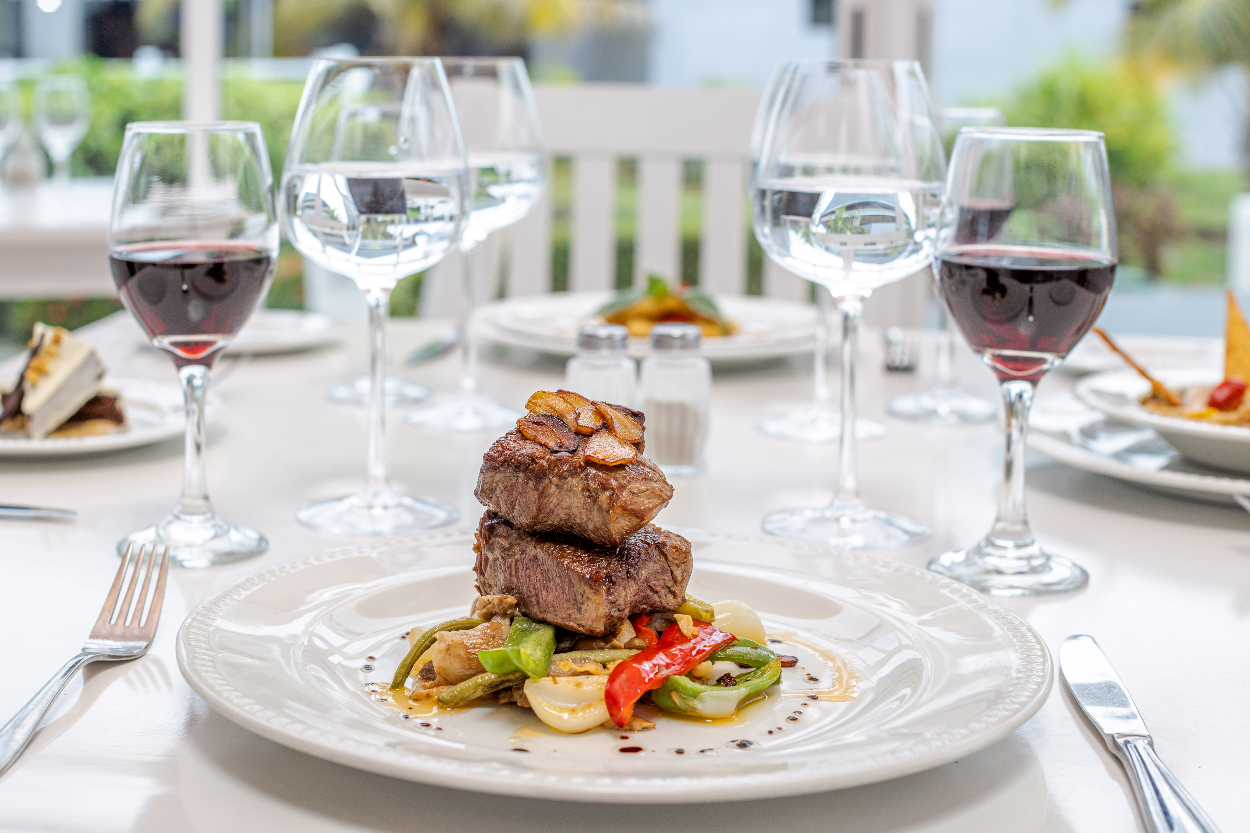 a plate of food and wine glasses