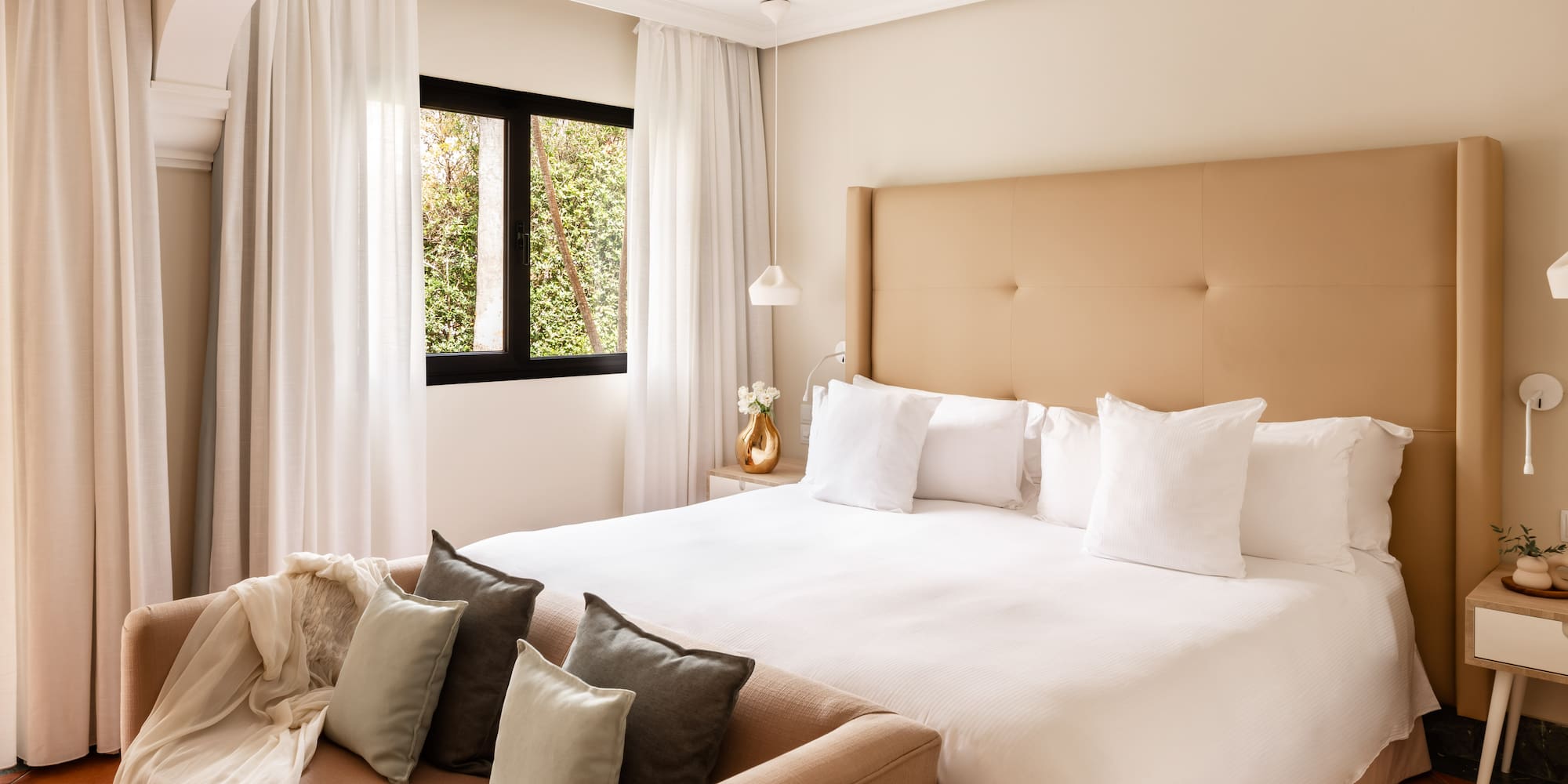 a bed with pillows in a room