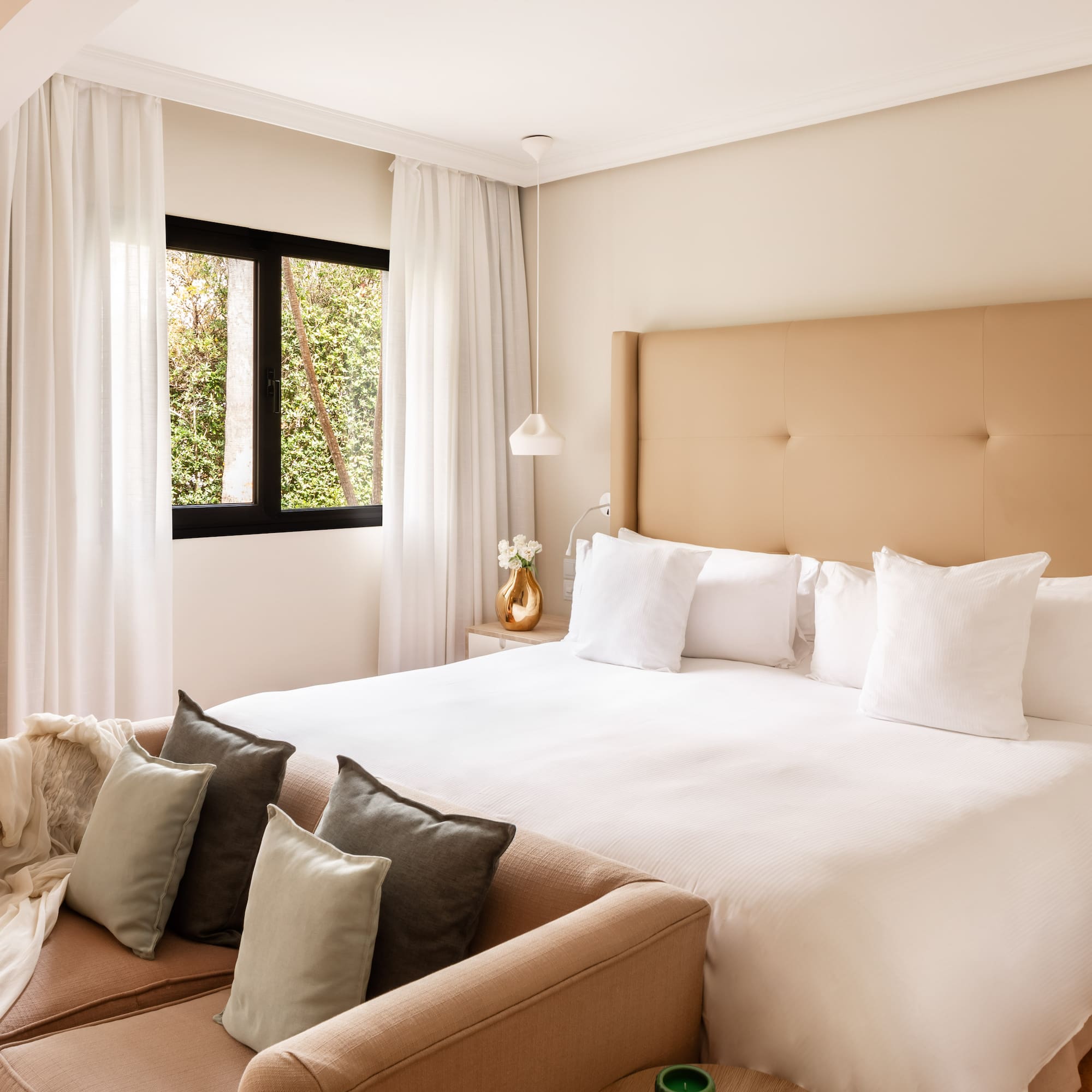 a bed with pillows in a room