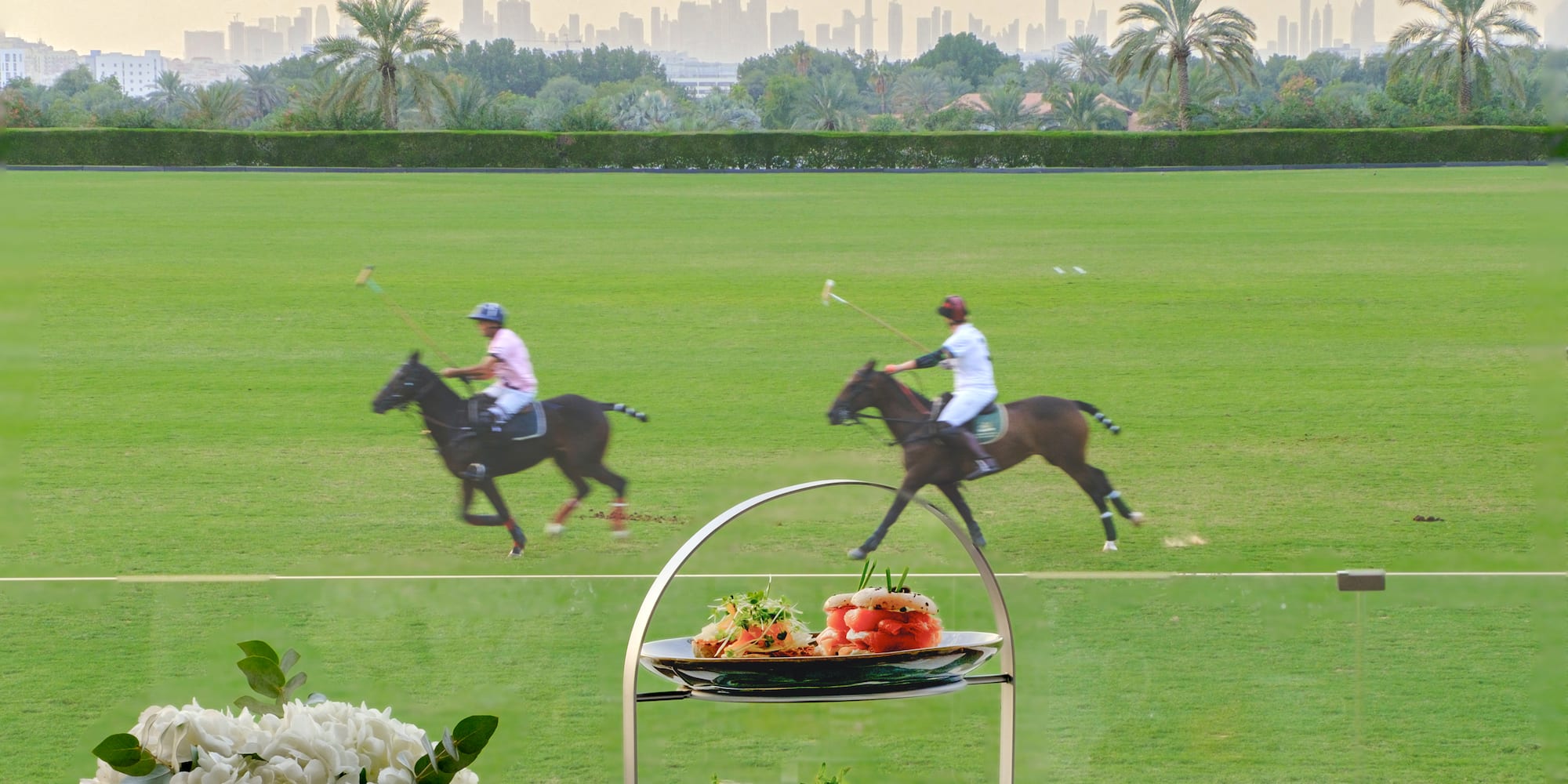 a table with a couple of people riding horses on it