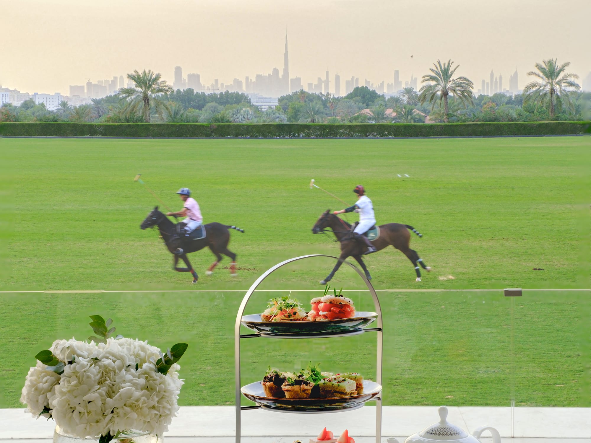 a table with a couple of people riding horses on it