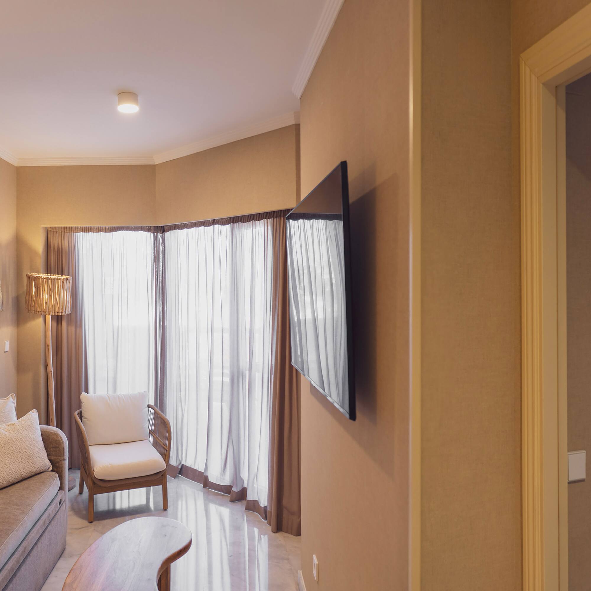 a living room with a tv and a couch