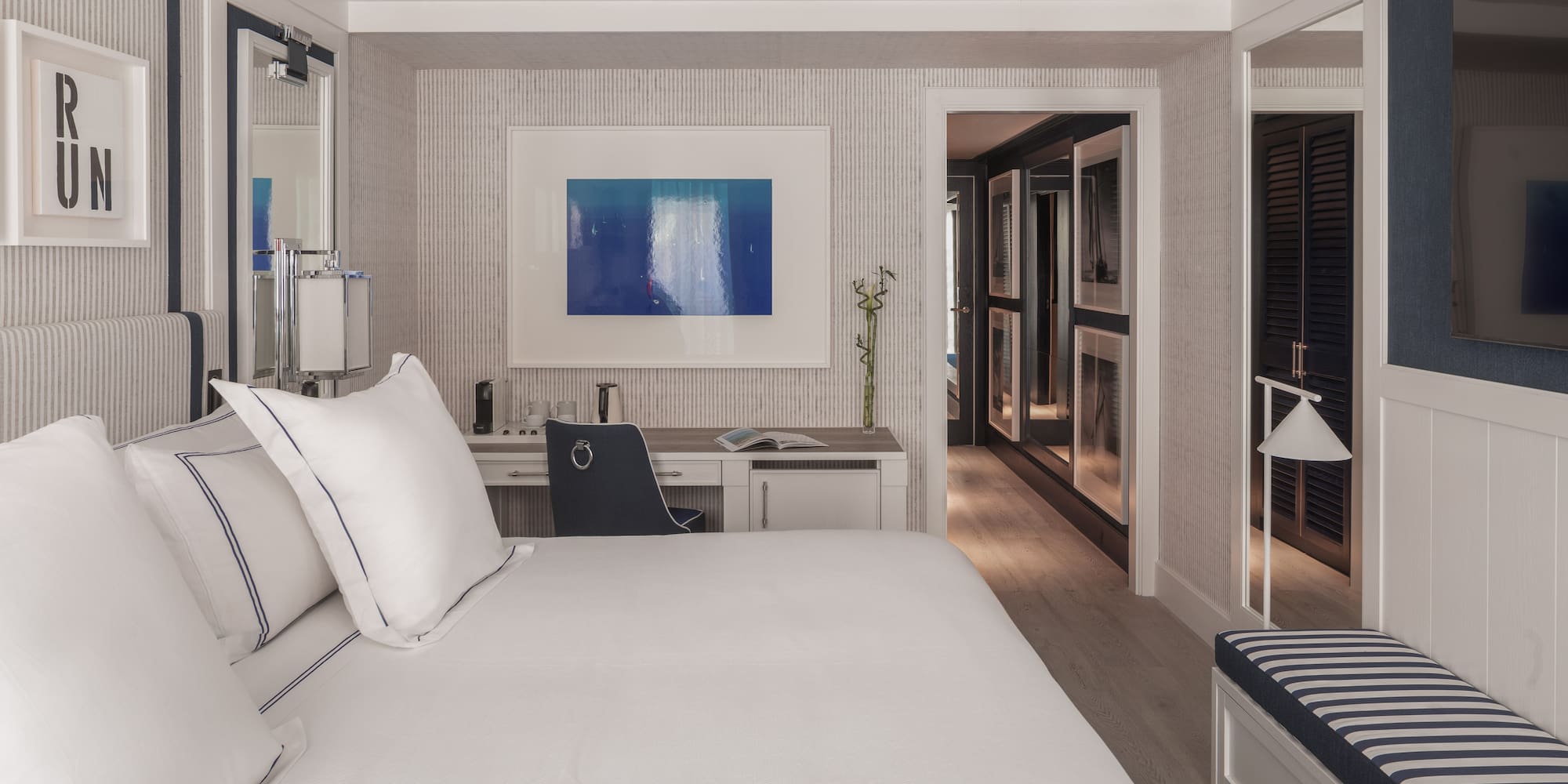 a room with a bed and a desk