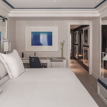 a room with a bed and a desk