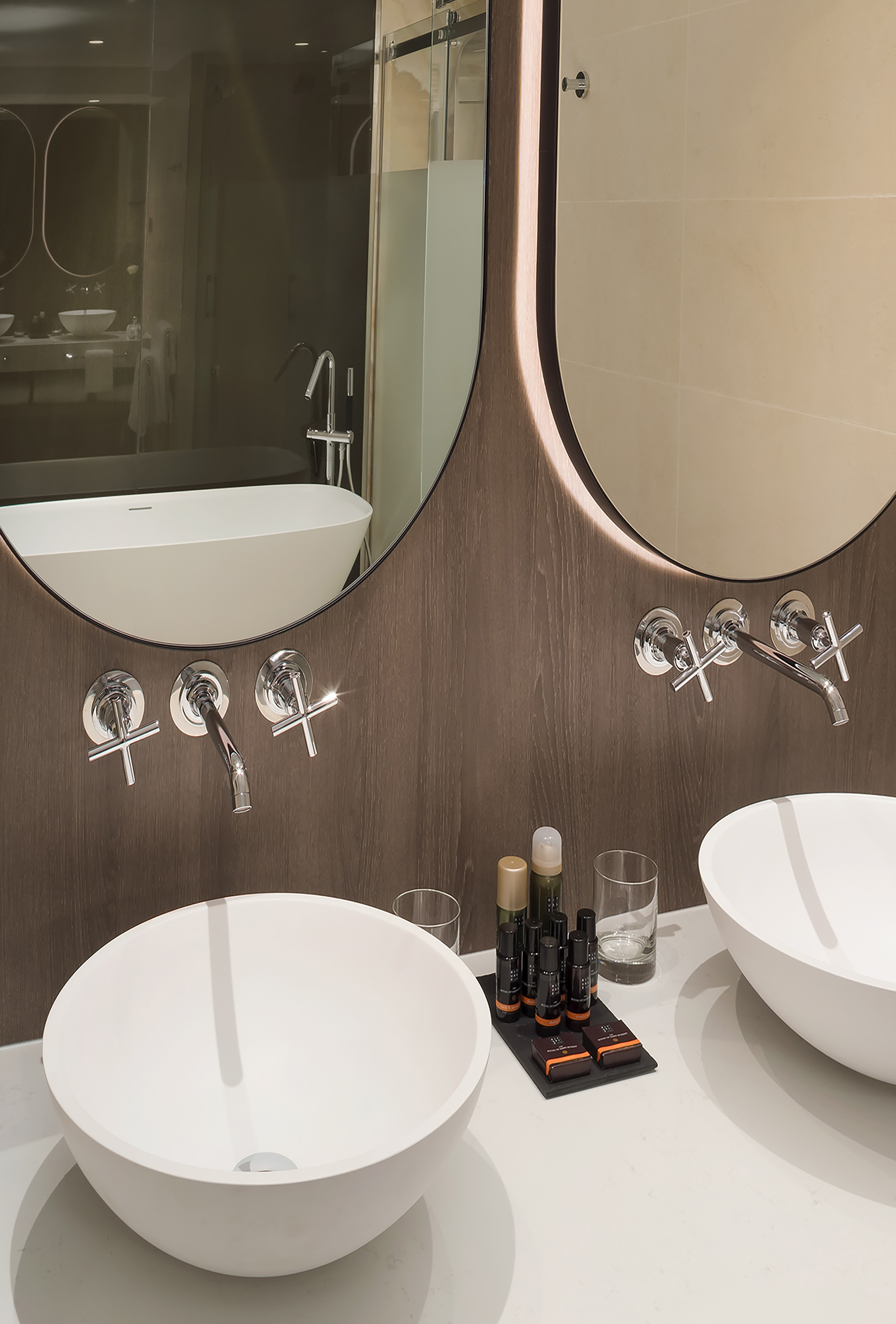 a bathroom with two sinks and a mirror