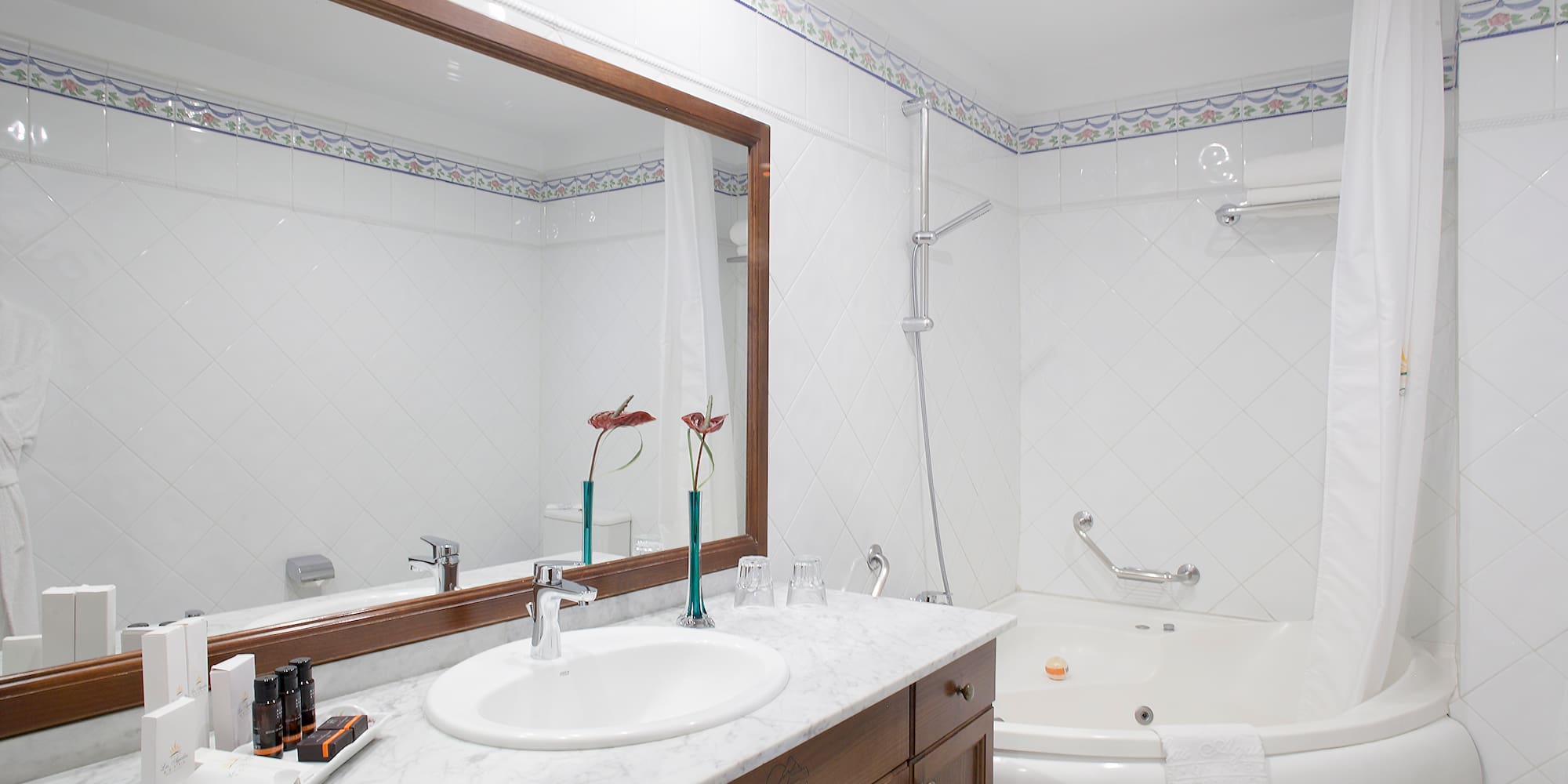 a bathroom with a tub and sink