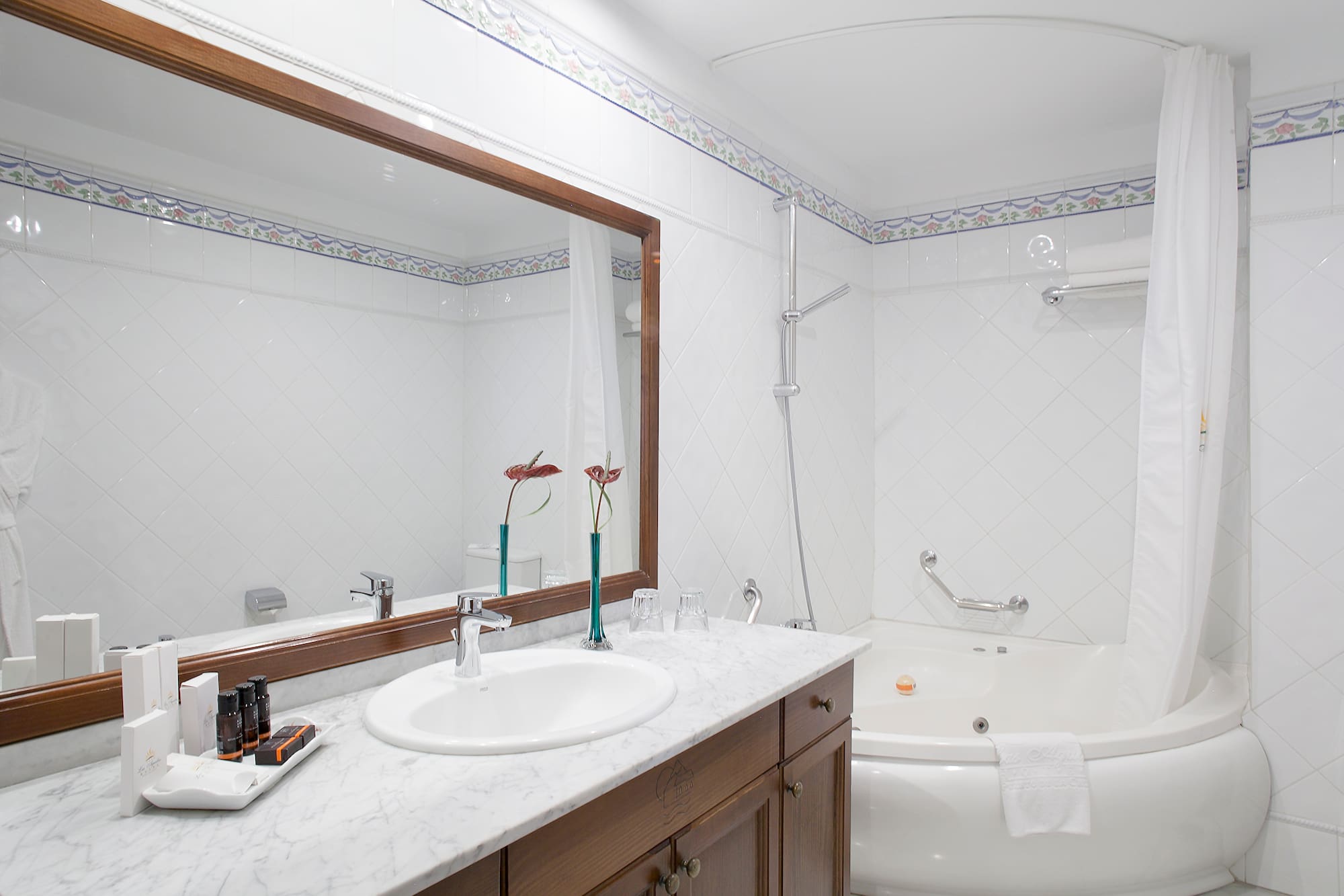 a bathroom with a tub and sink