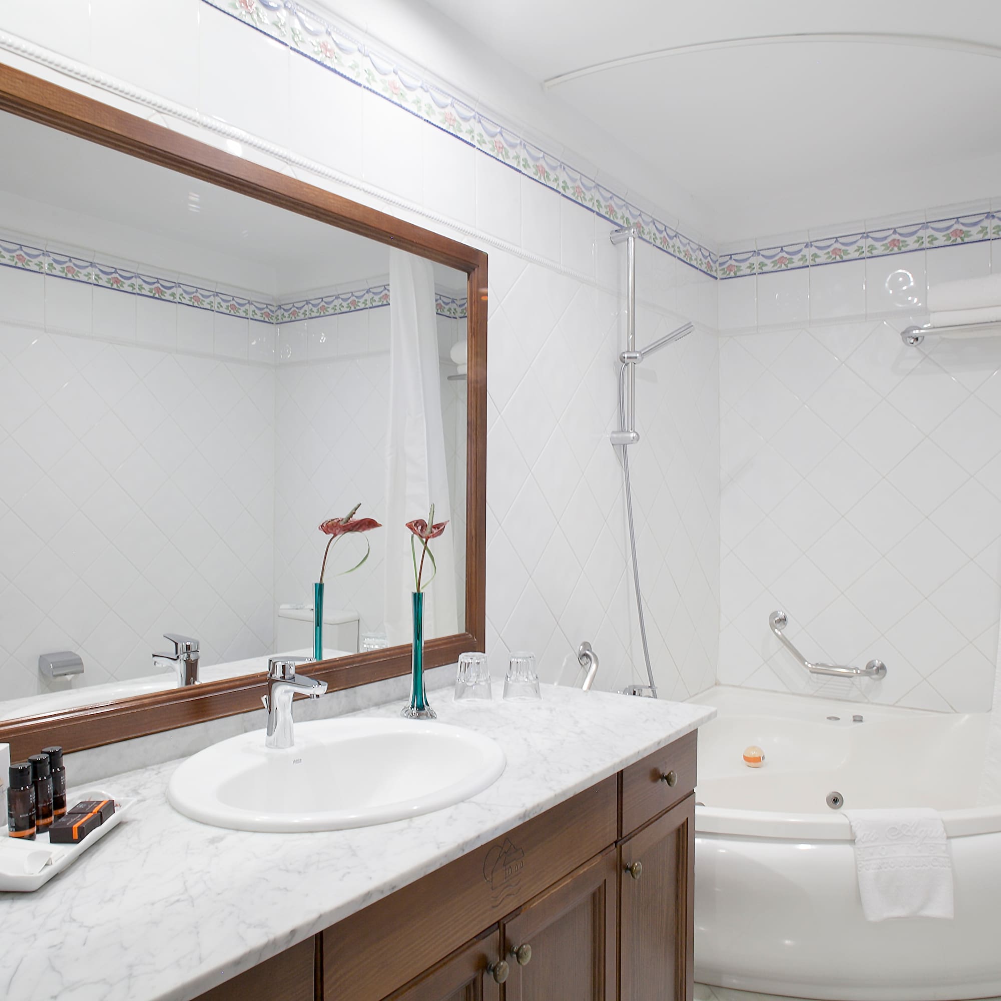 a bathroom with a tub and sink