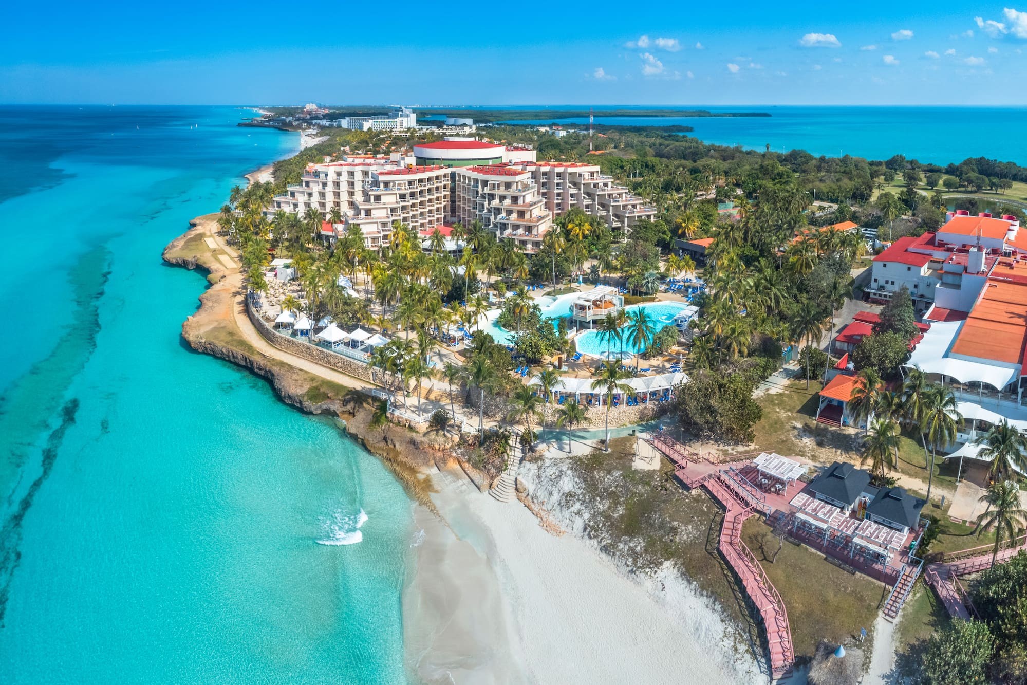 a resort with a pool and a beach