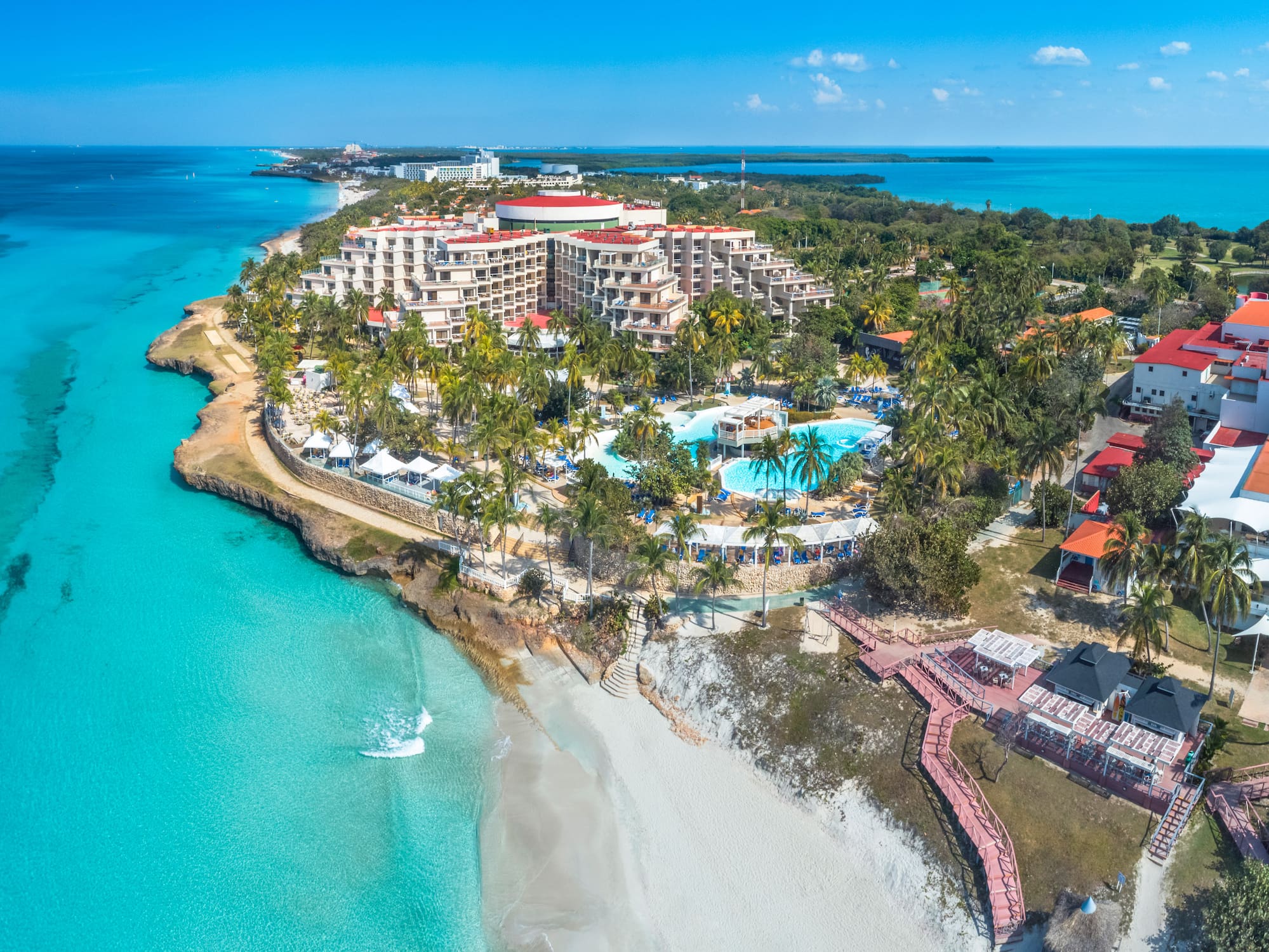 a resort with a pool and a beach