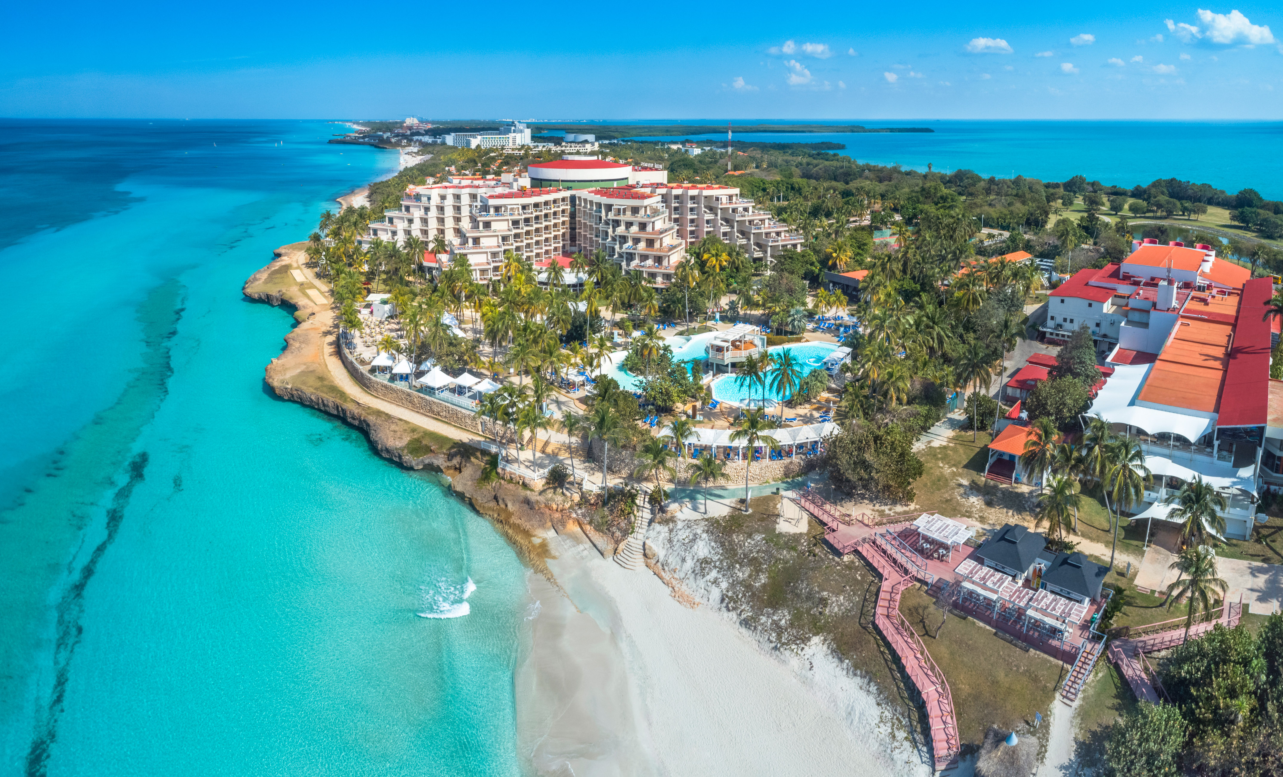 a resort with a pool and a beach