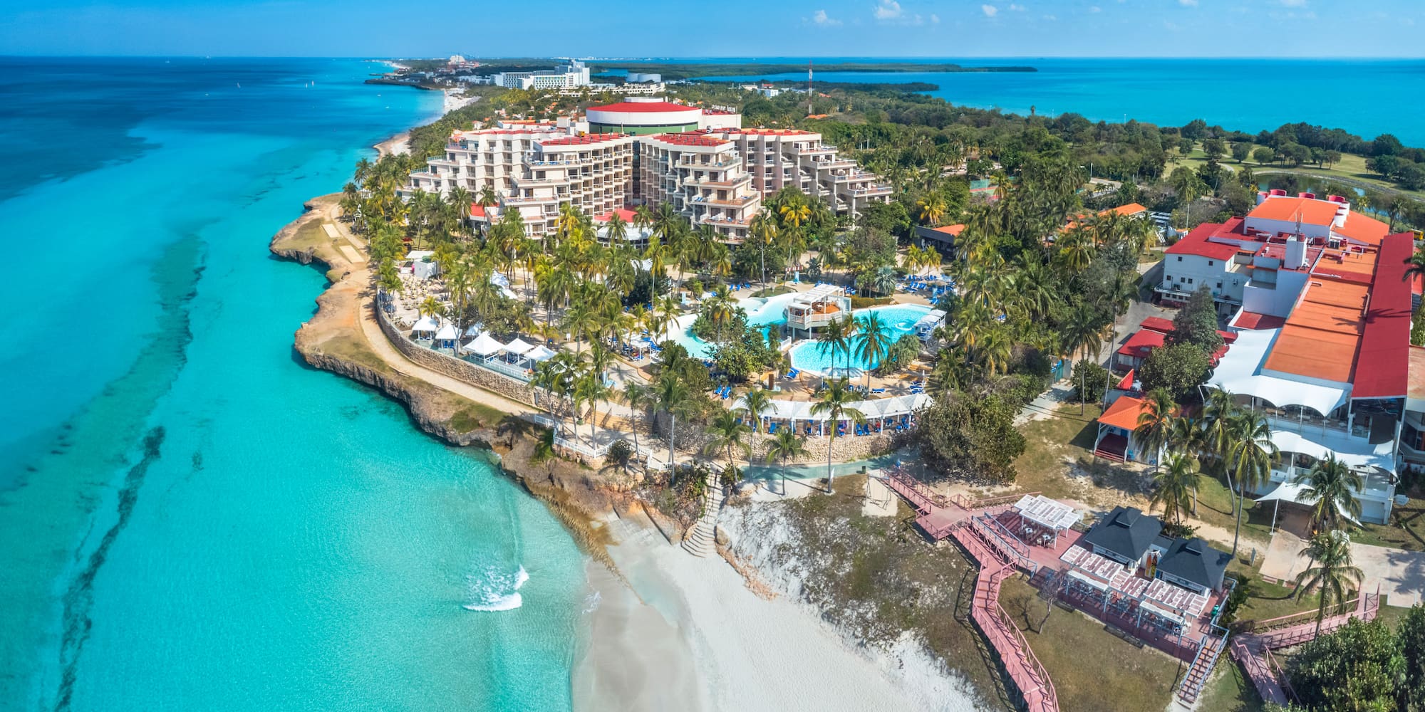a resort with a pool and a beach
