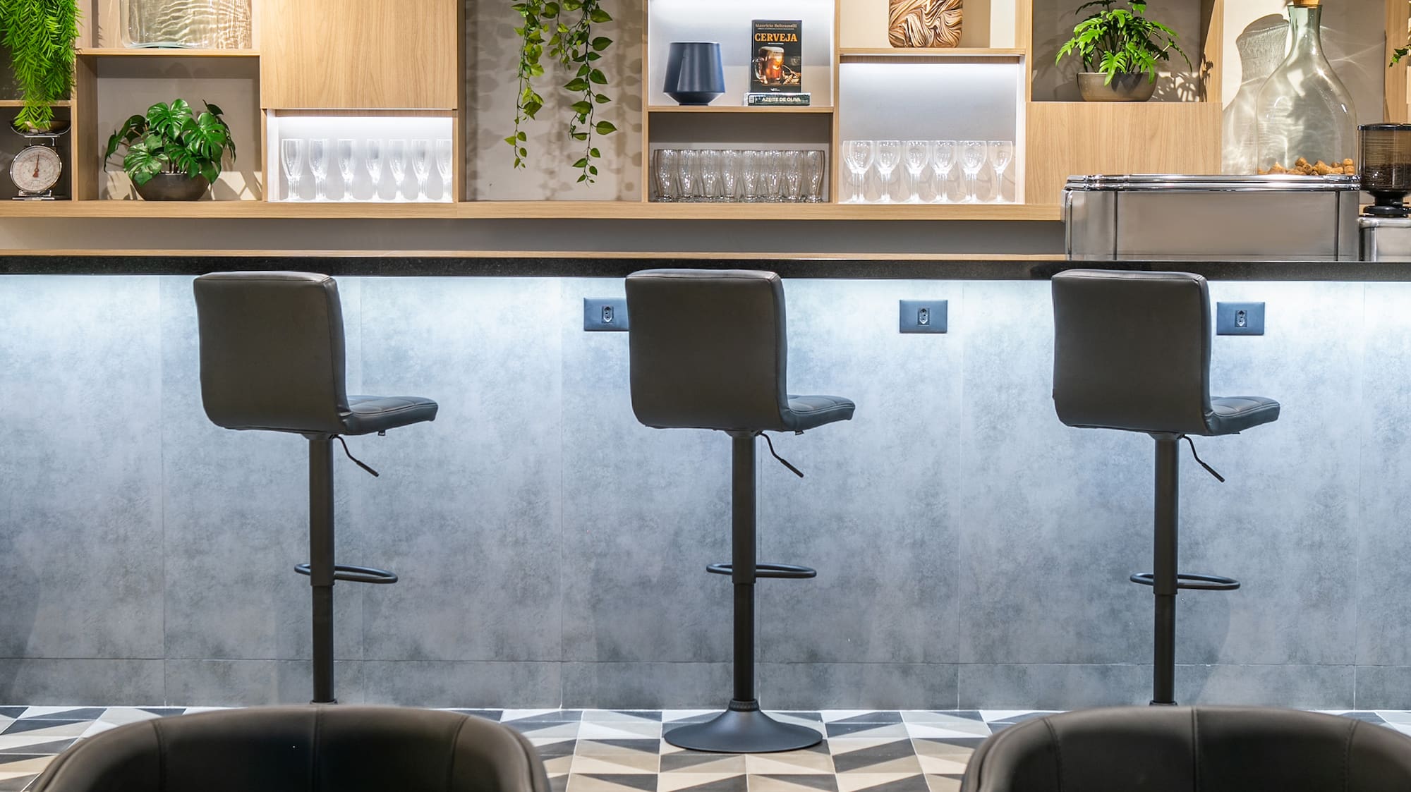 a bar with chairs and shelves