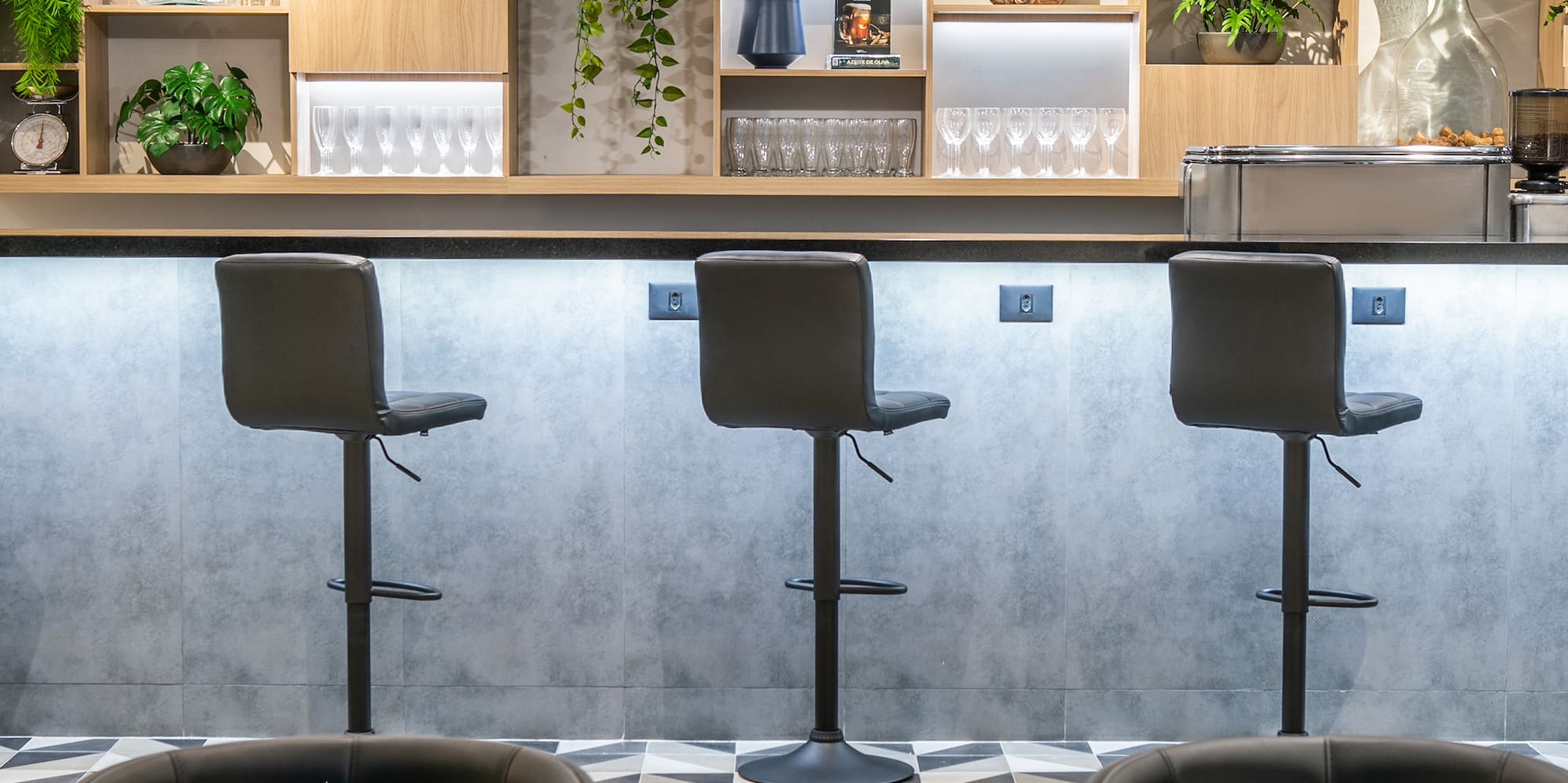 a bar with chairs and shelves