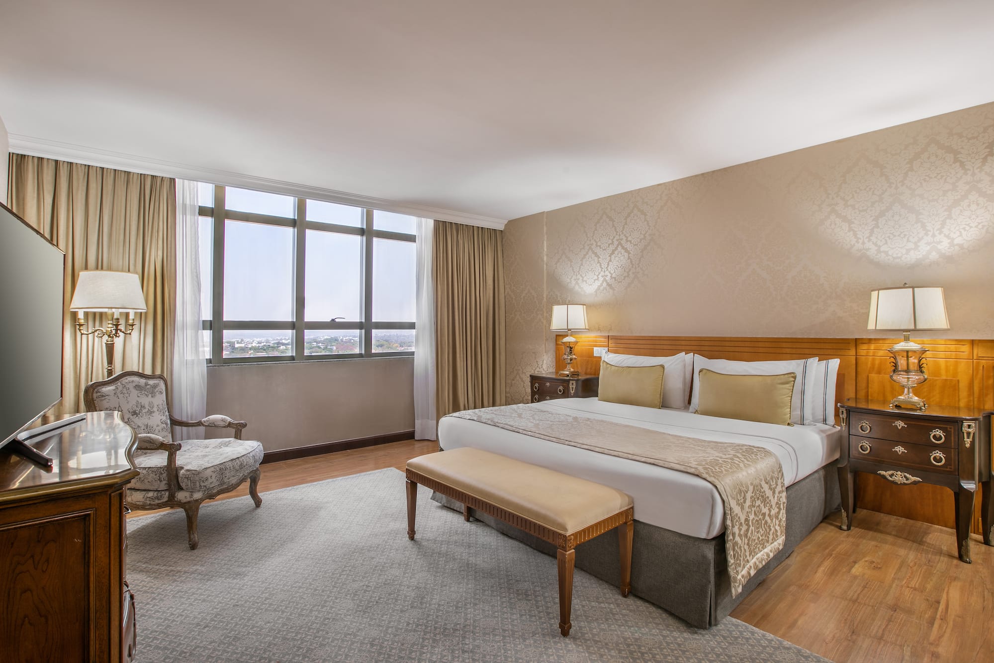 a bedroom with a bed and a chair