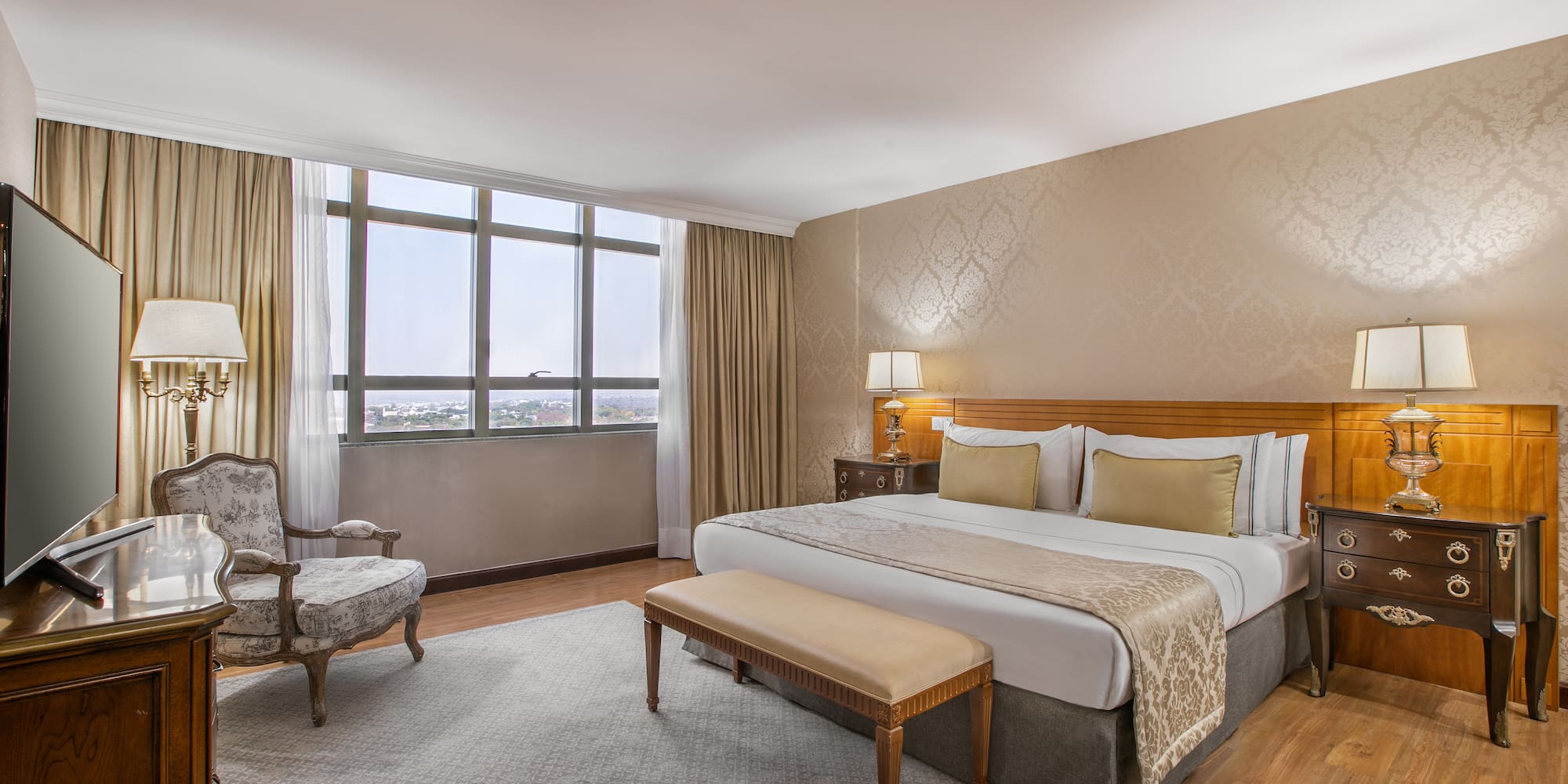 a bedroom with a bed and a chair