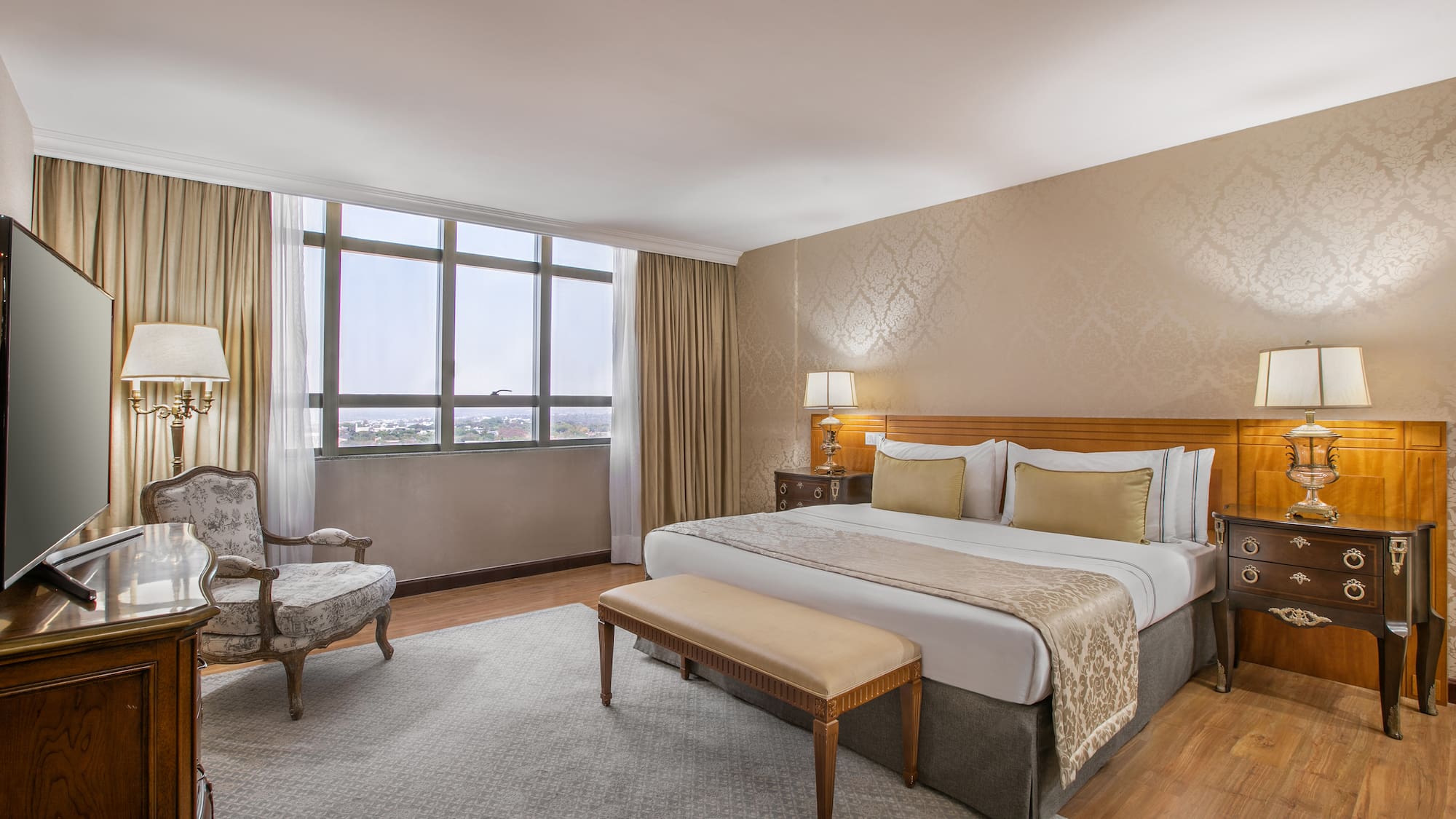 a bedroom with a bed and a chair