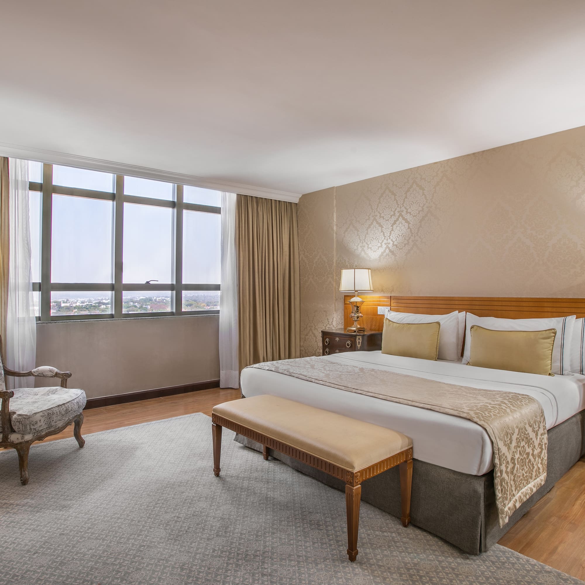 a bedroom with a bed and a chair