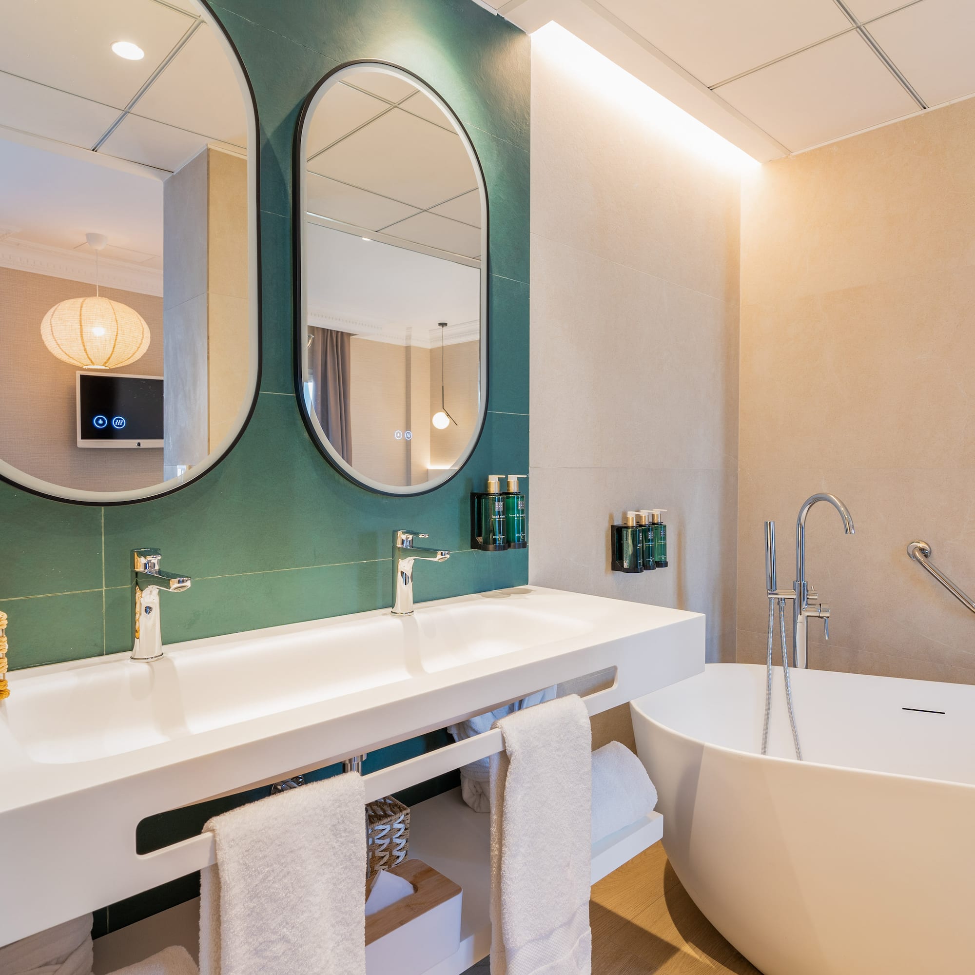 a bathroom with a tub and sink