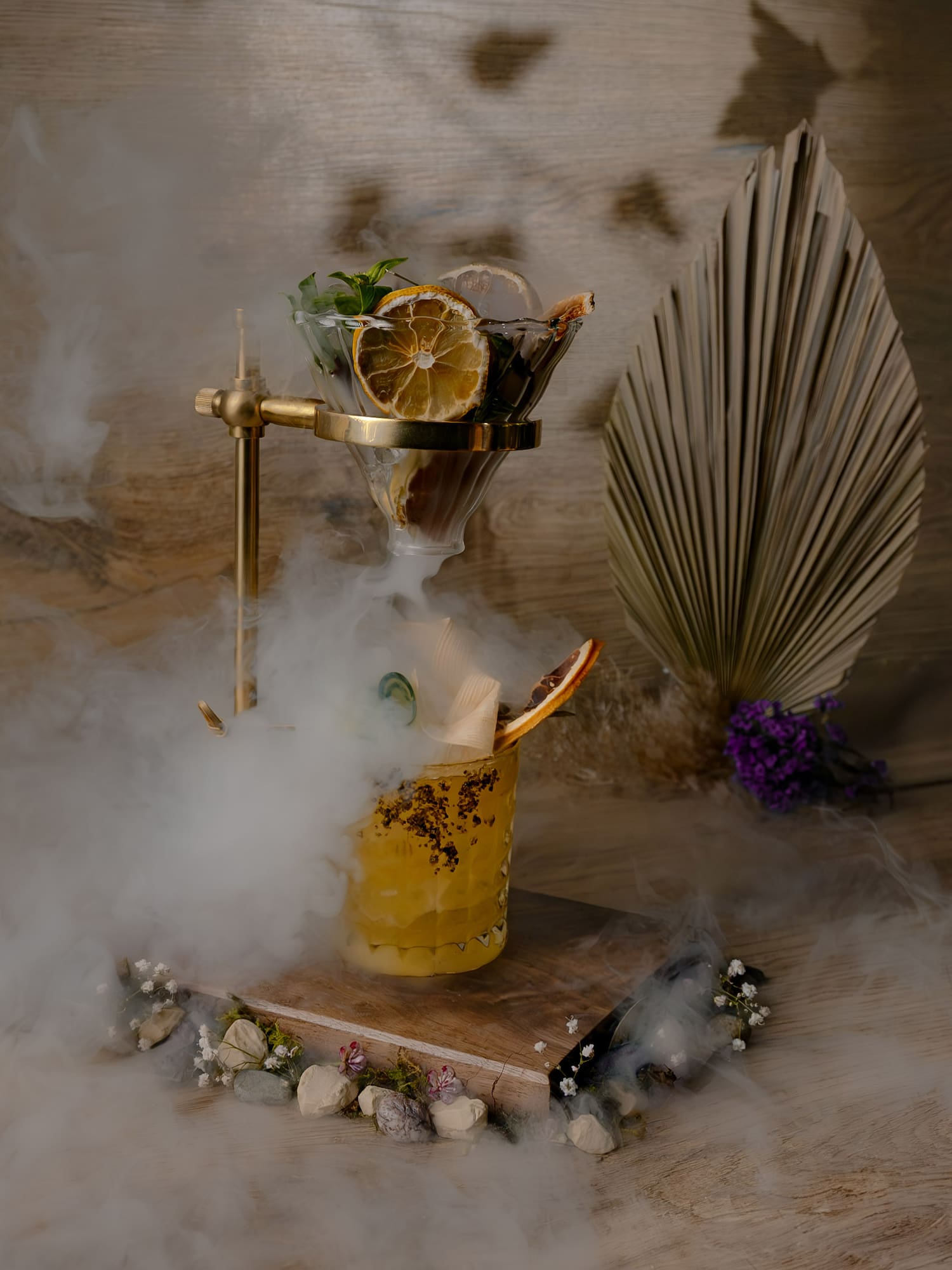 a glass with fruit in it and a glass with smoke