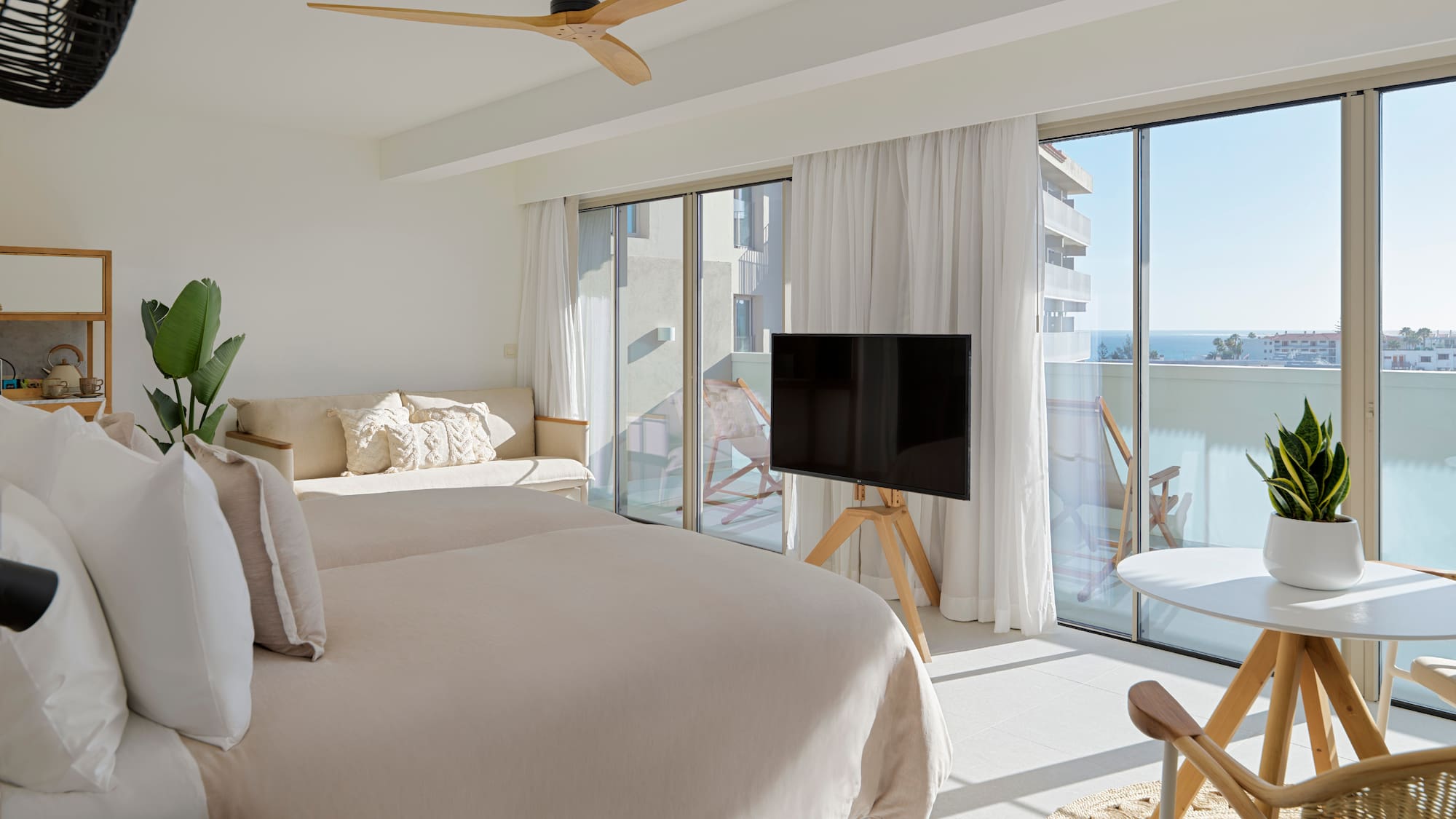 a bedroom with a television and a bed