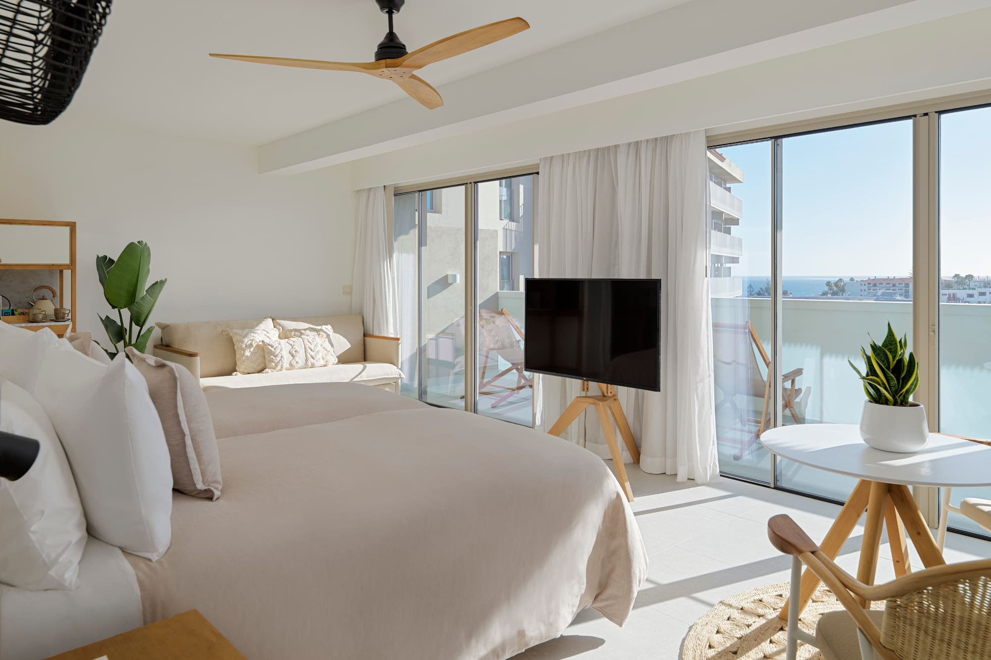 a bedroom with a television and a bed