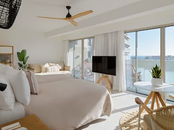 a bedroom with a television and a bed