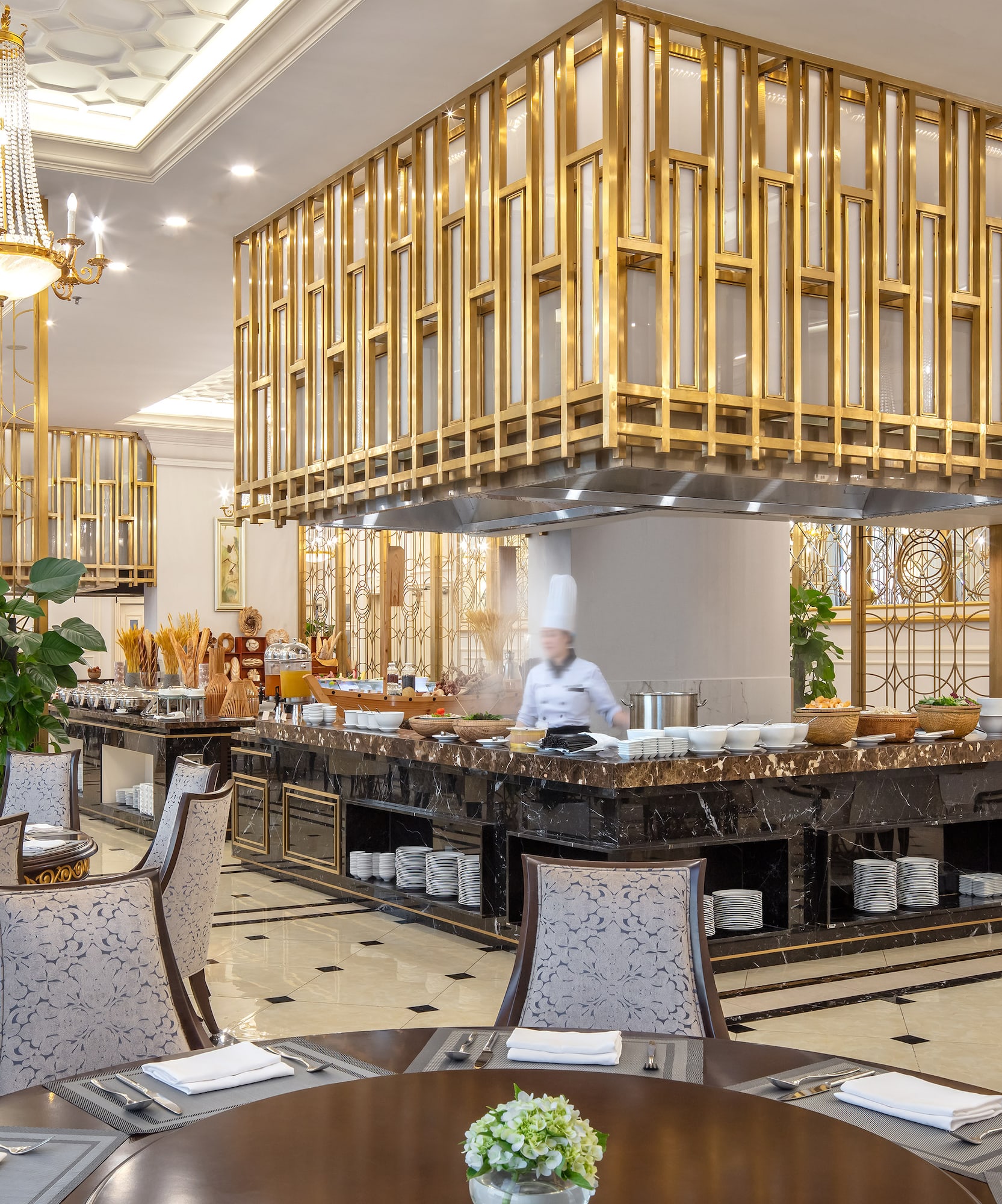 a restaurant with a chef behind the counter