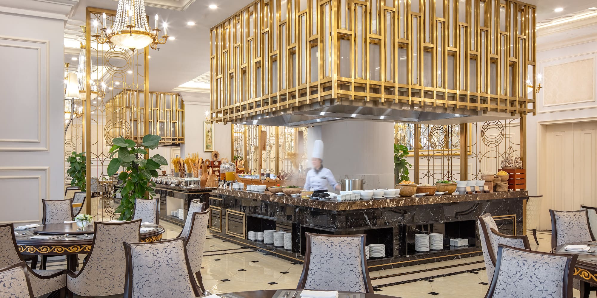 a restaurant with a chef behind the counter