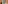 Terracotta tiled hotel bathroom with white bathtub, vanity, and mirror.