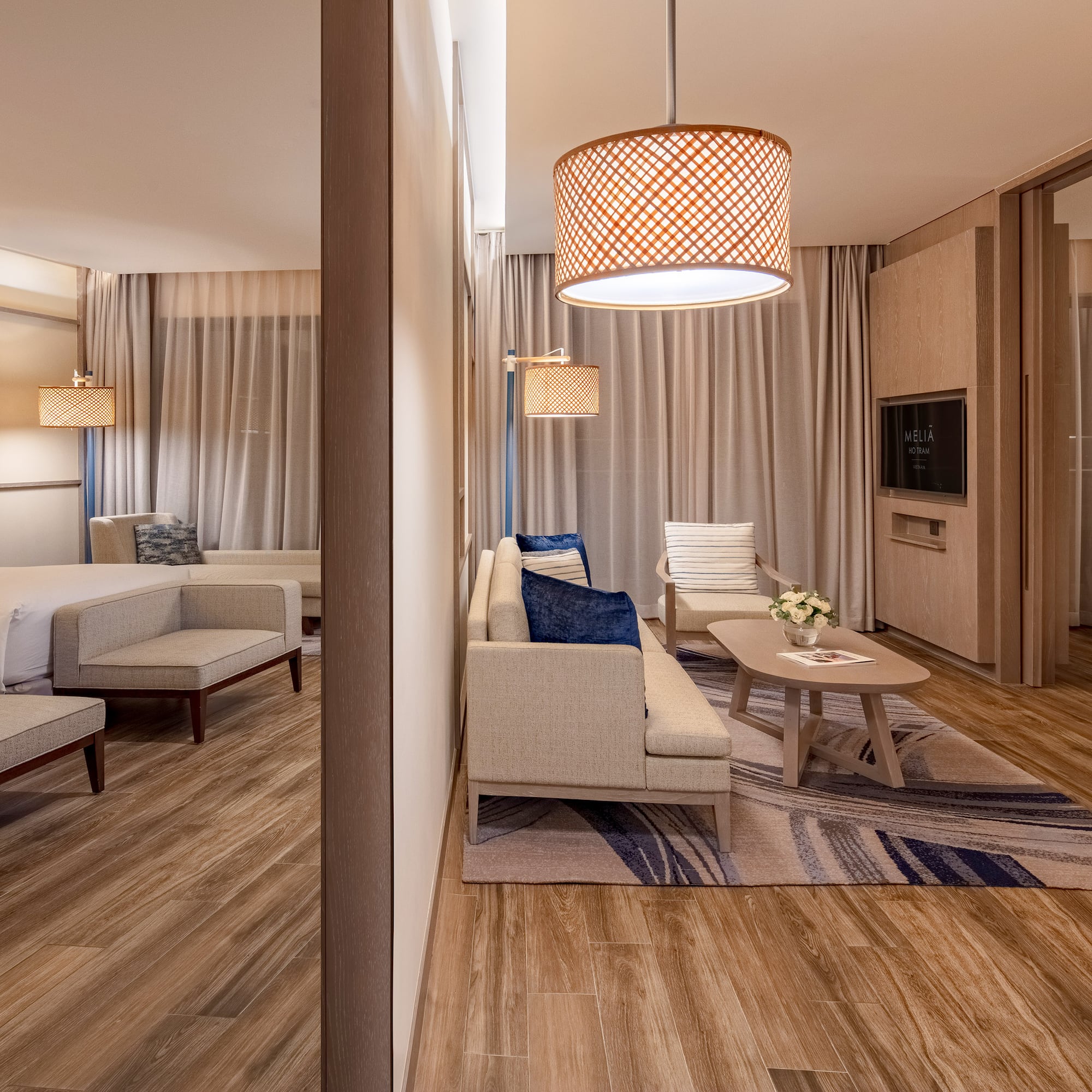 a room with a bed and couches