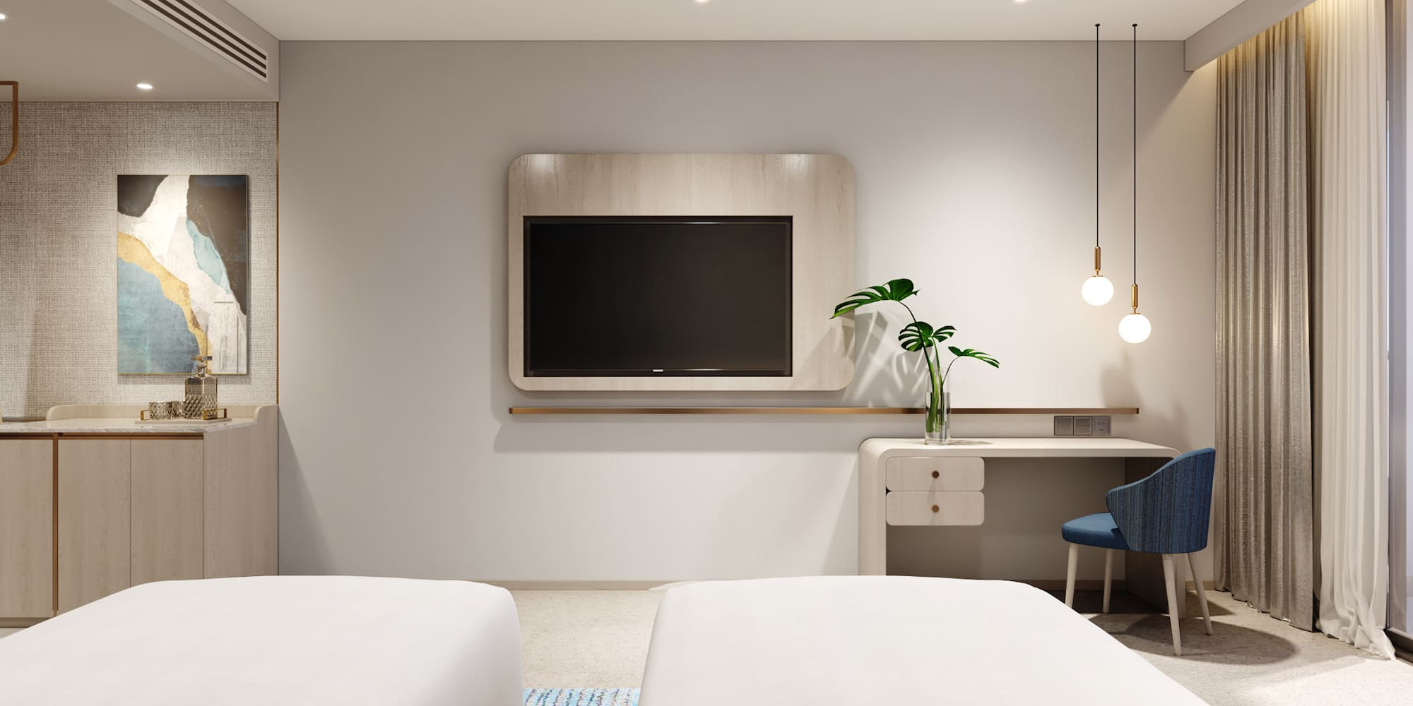 a room with two beds and a tv on the wall
